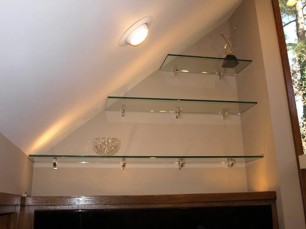Glass shelves on a slanted wall