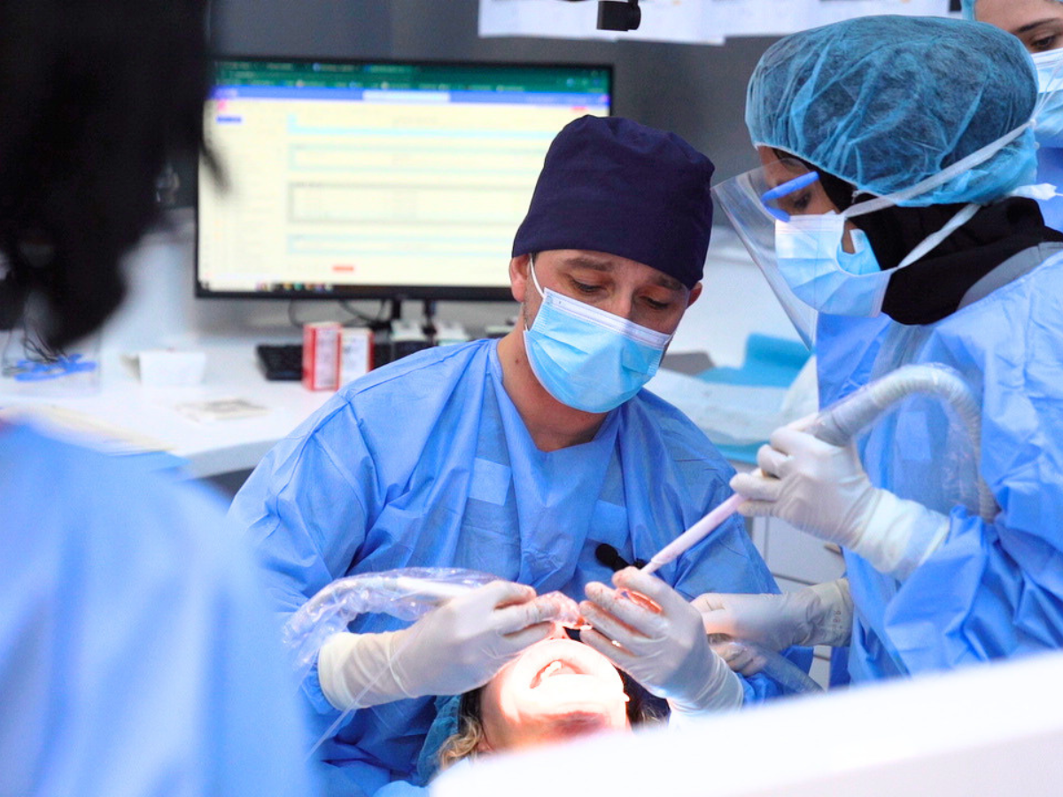 Live implant surgery with mentor guidance