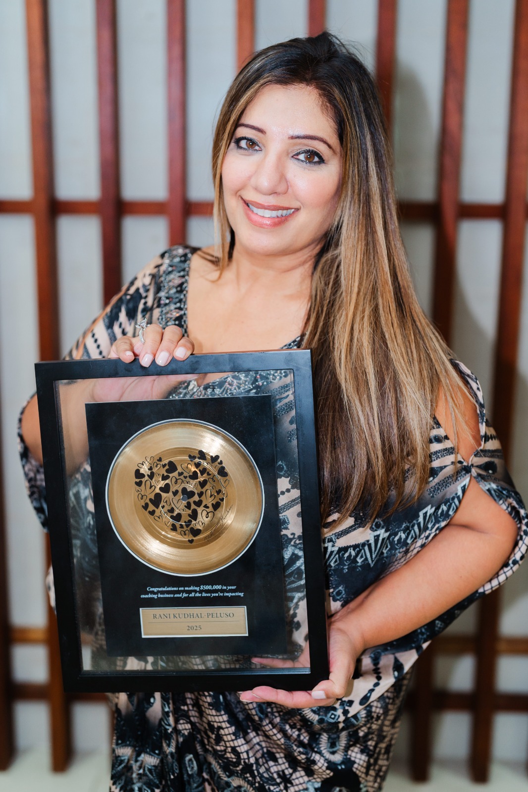 Rani Peluso with award