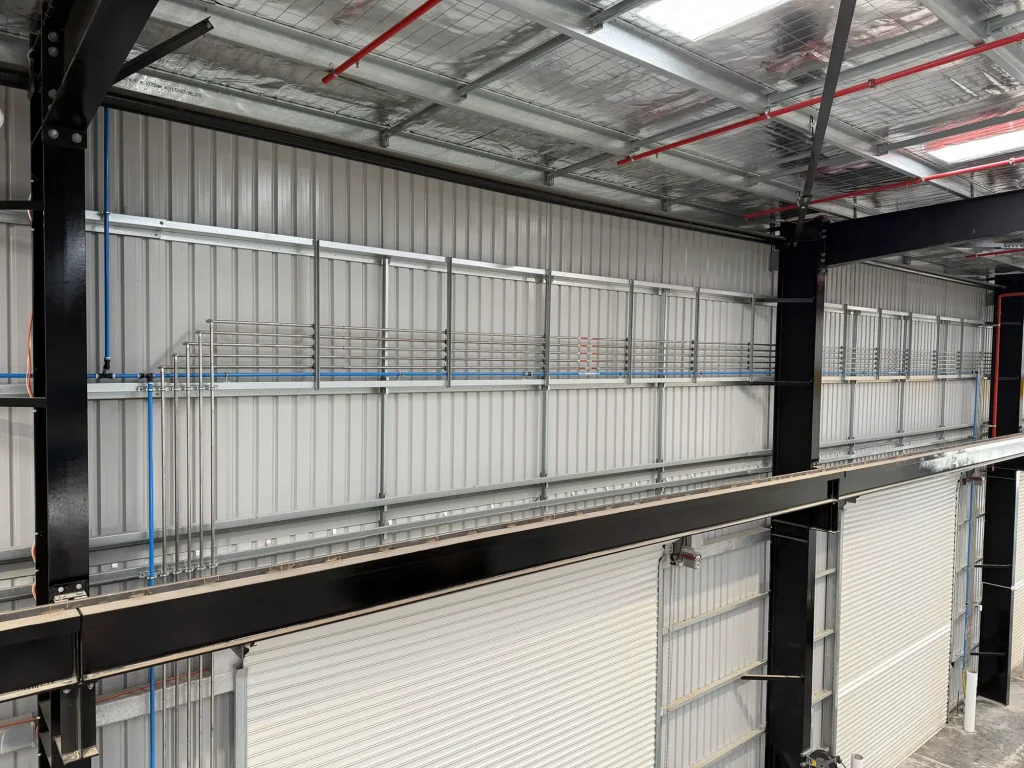 Compressed air pipe runs along a factory wall