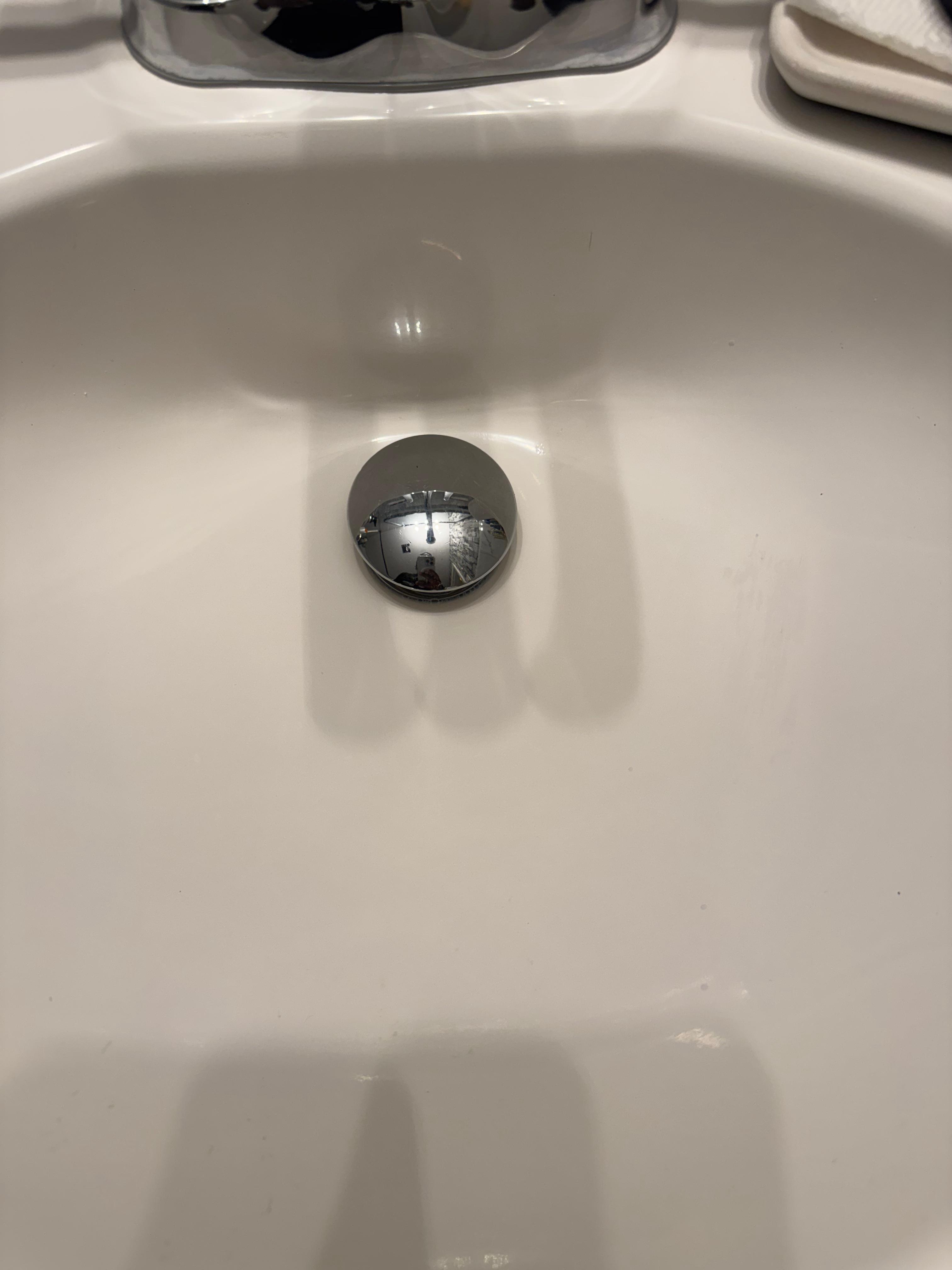 Bathroom sink after cleaning — spotless and gleaming