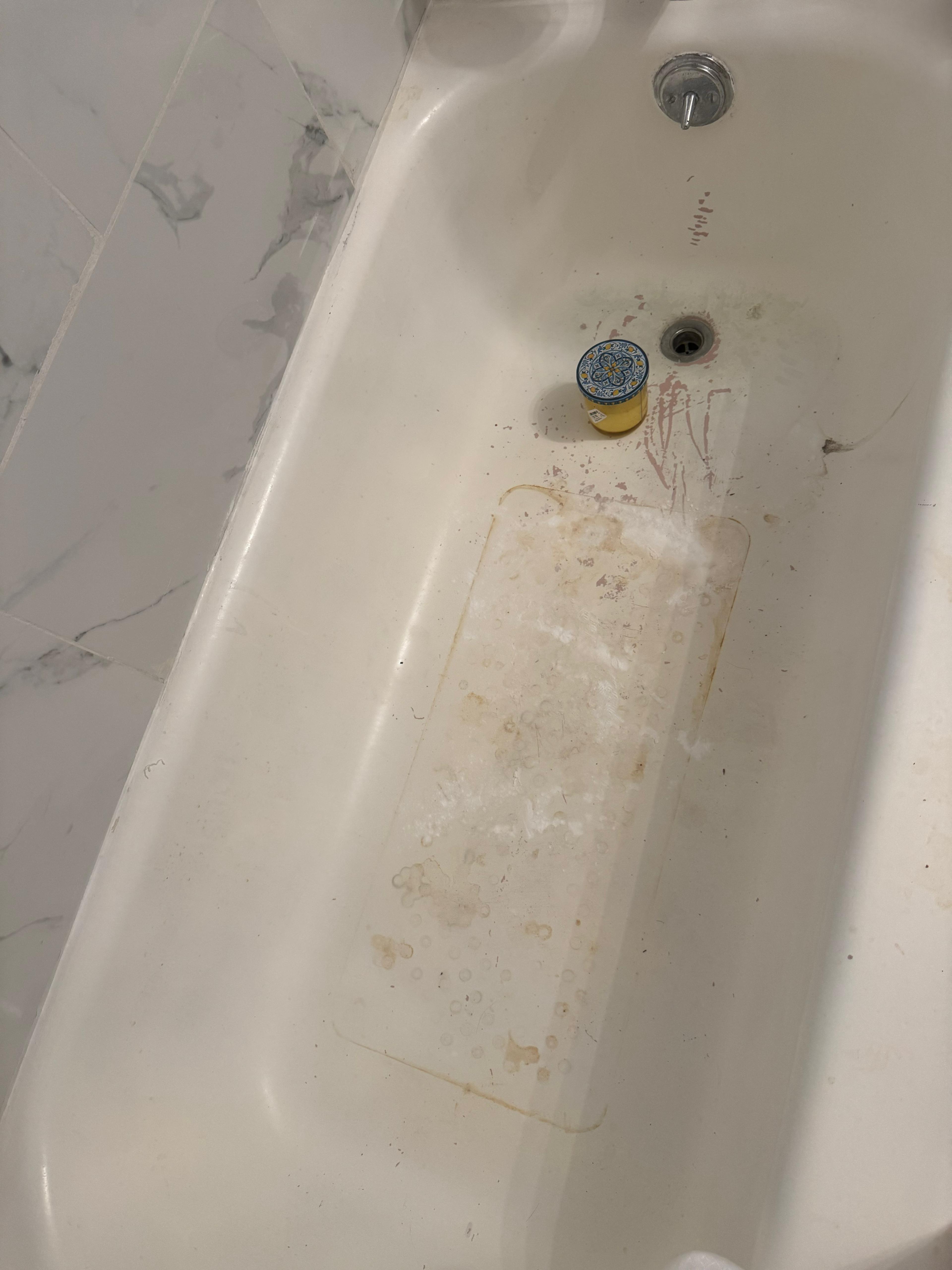 Bathtub before cleaning — stained and dirty