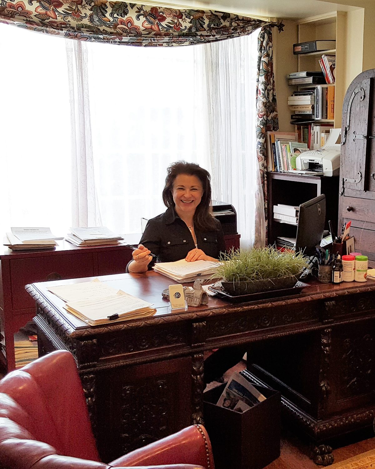 Dr. Tamara Sachs at her desk in her New Milford, Connecticut office.