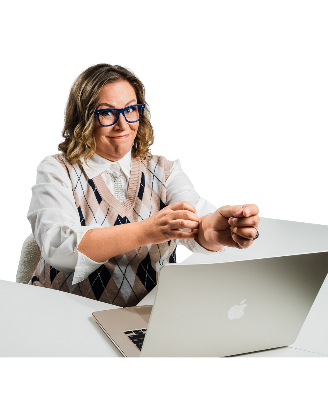 Wendi at her laptop, mid-gesture, working through a client's list