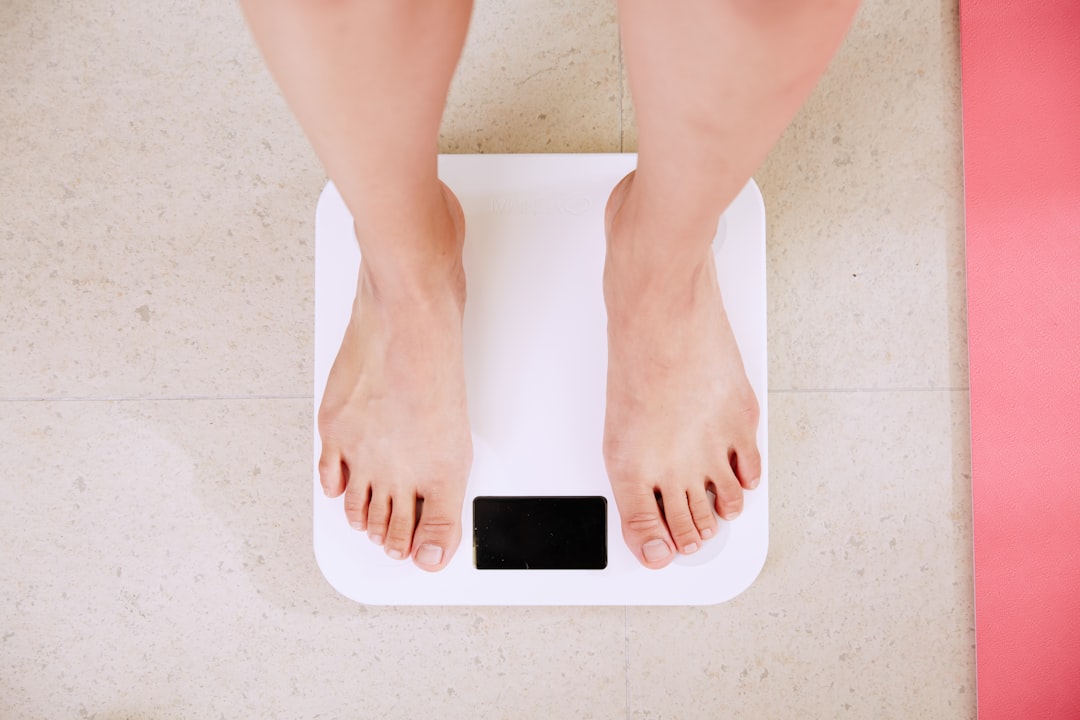 Woman standing on scales