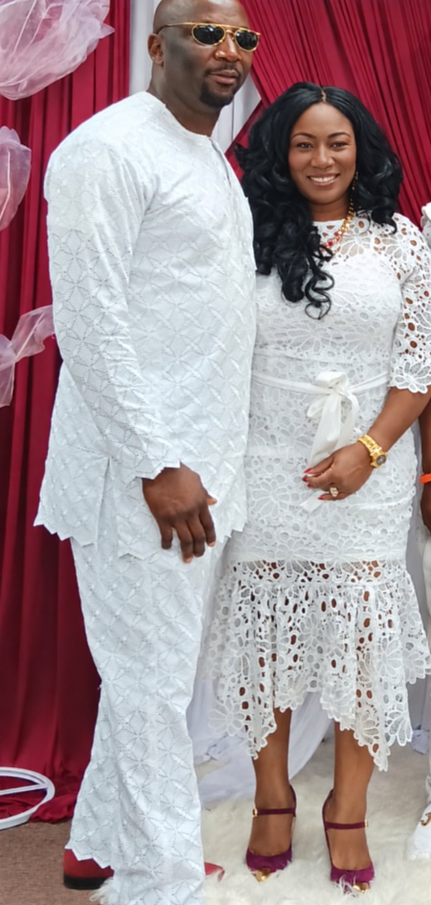 Mr. and Mrs. (Dr.) Tuby Akinlosotu in matching white lace attire