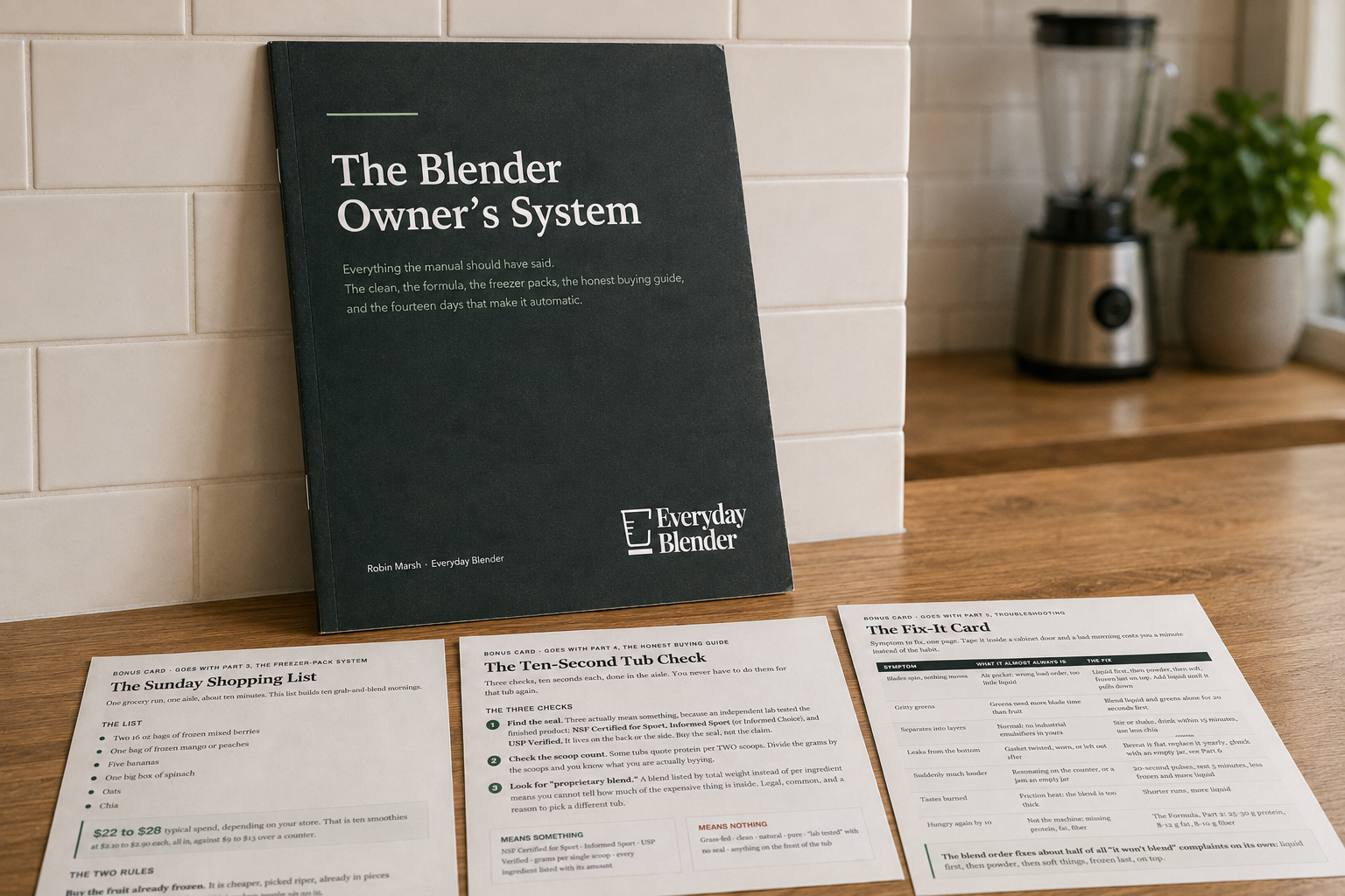 The Blender Owner's System propped on a kitchen worktop with its three bonus cards