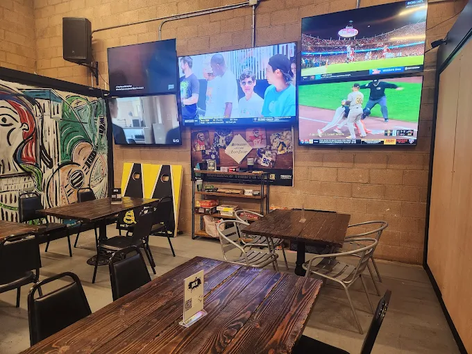 Brüe Crüe Taproom Interior — TVs, tables, murals
