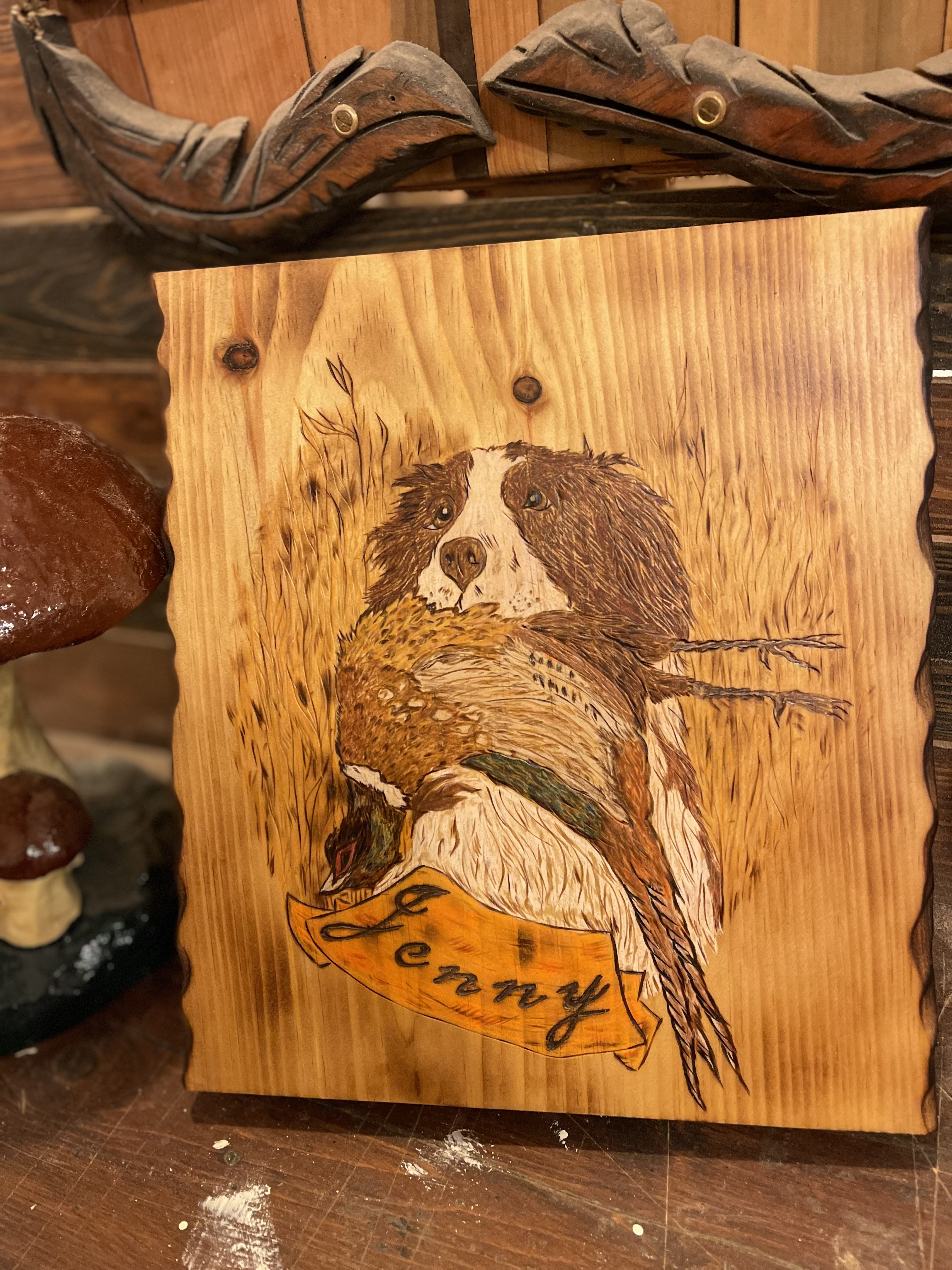 Hand-carved wooden memorial piece featuring a dog with pheasant, created by Keith at Sundanced Wood in Goshen, New York Hand-carved wooden memorial piece featuring a dog with pheasant, created by Keith at Sundanced Wood in Goshen, New York