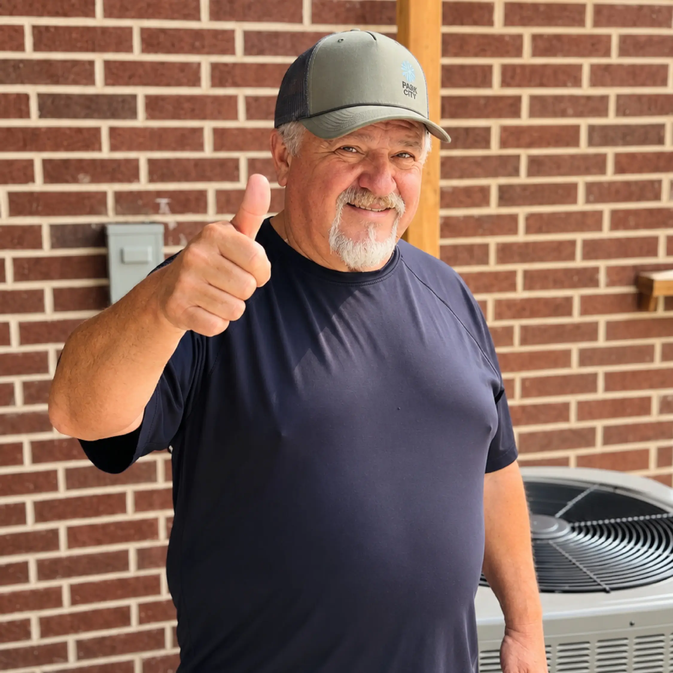 Customer next to his new Rheem condenser