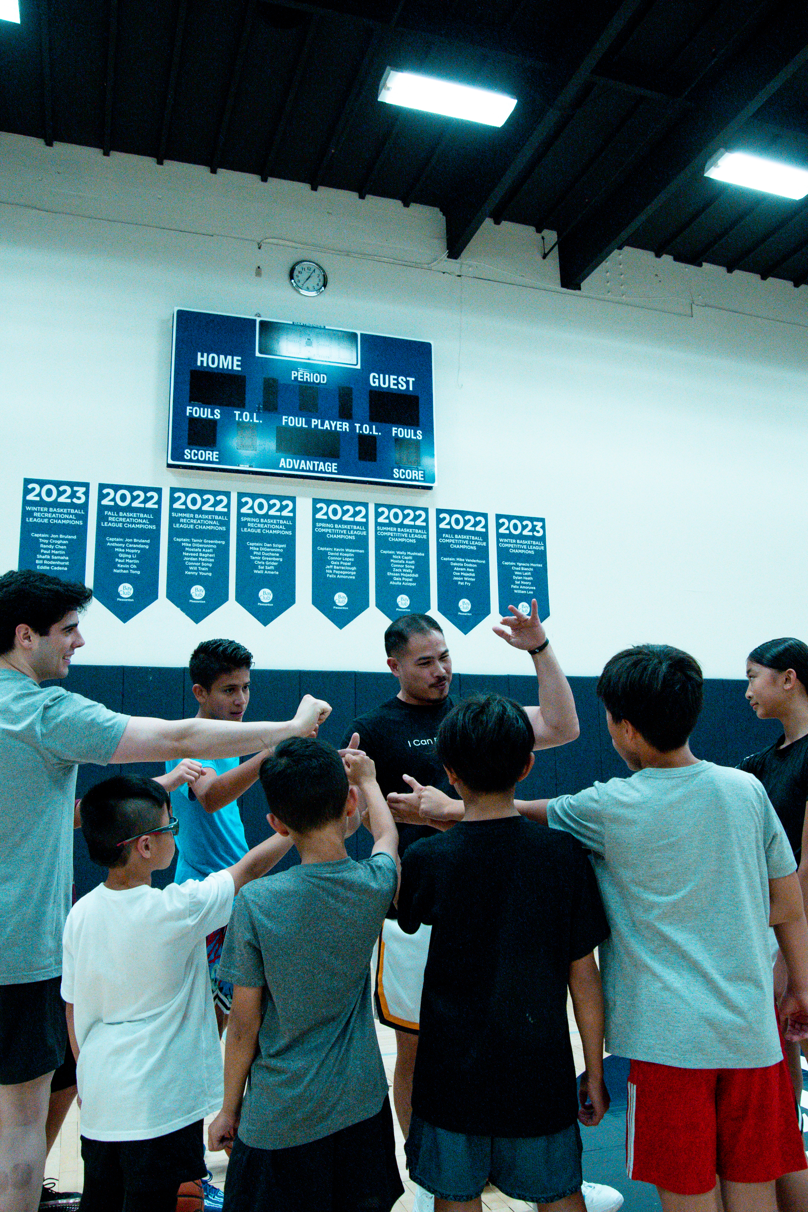 ICAN coach and players huddled at Bay Club Pleasanton