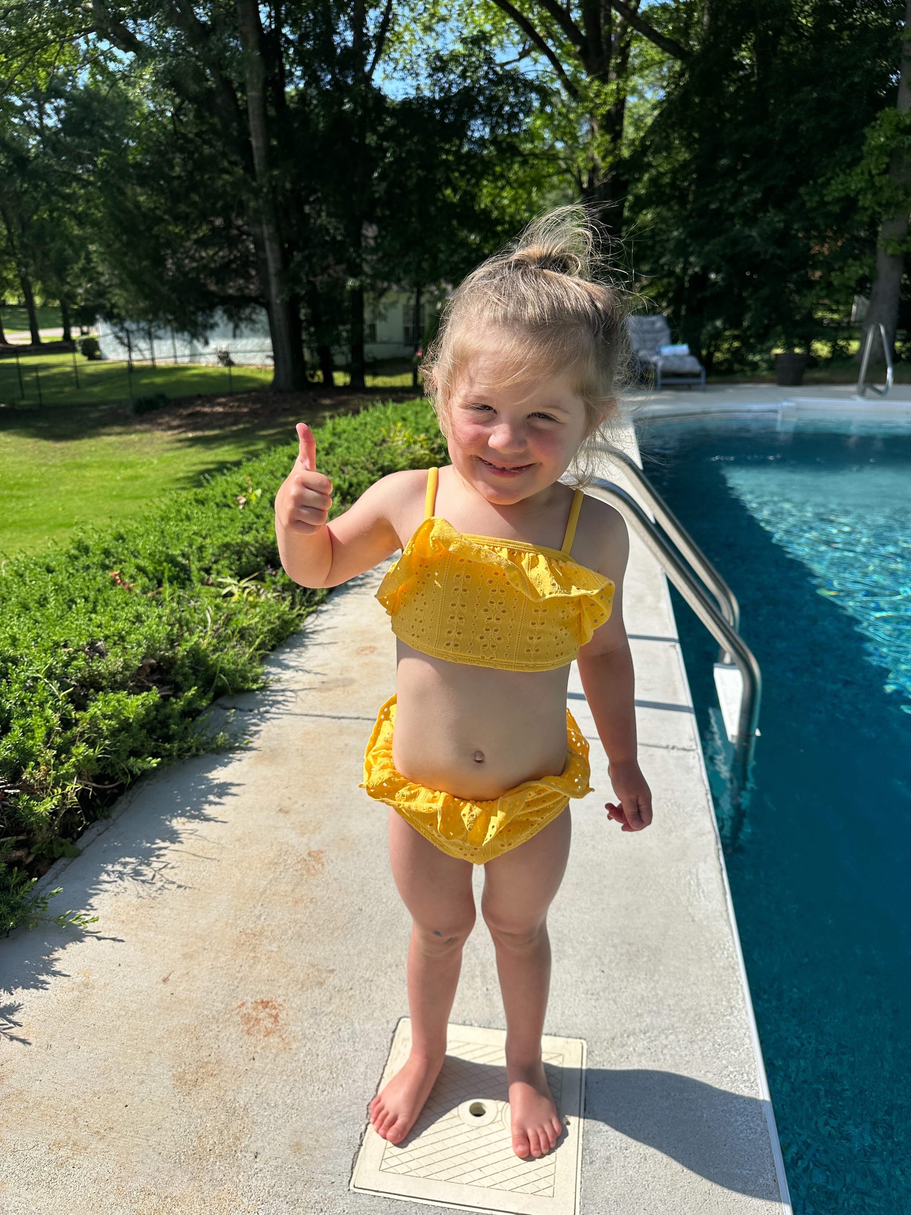 Happy student in yellow swimsuit