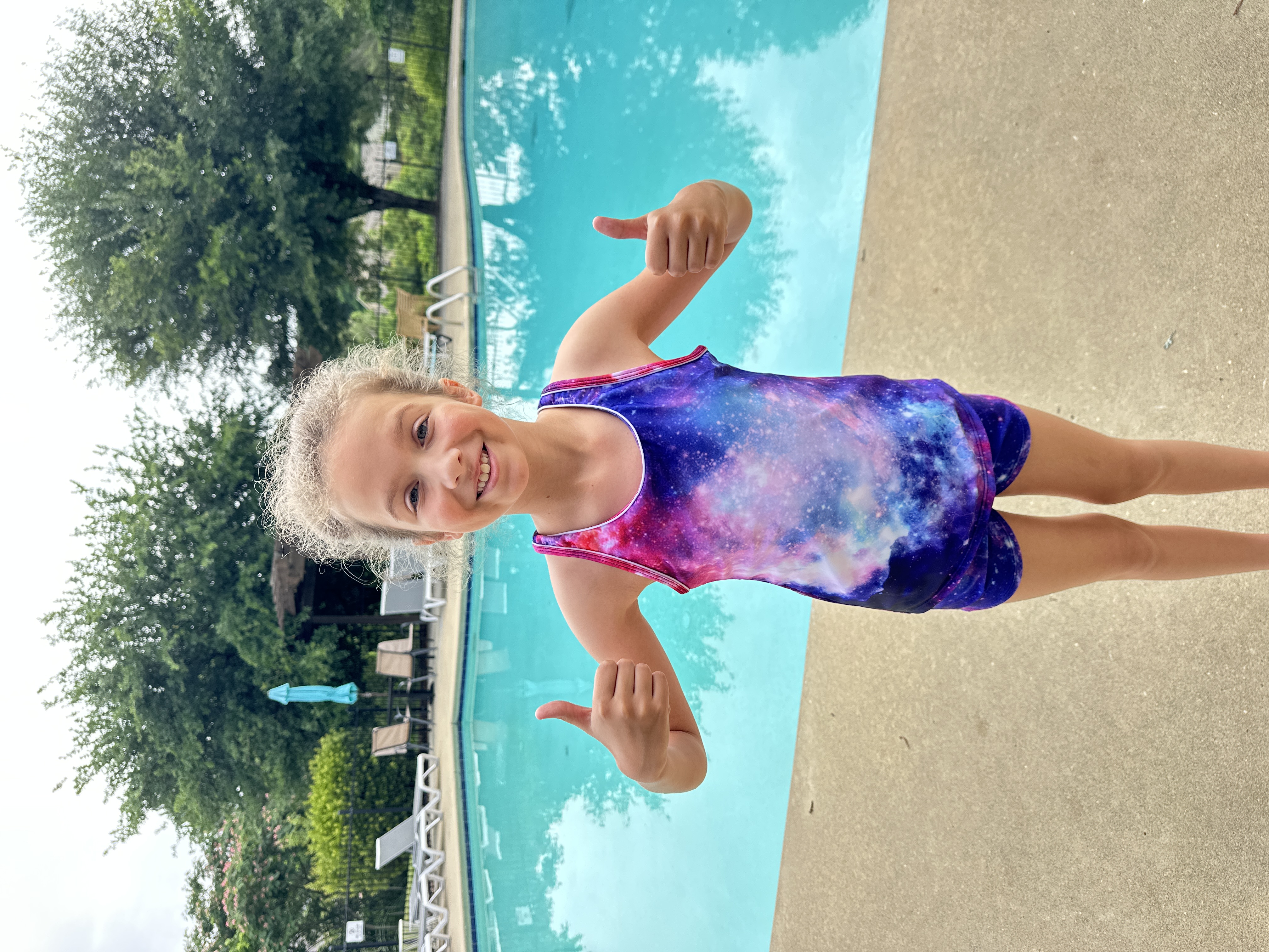Cheerful student by the pool