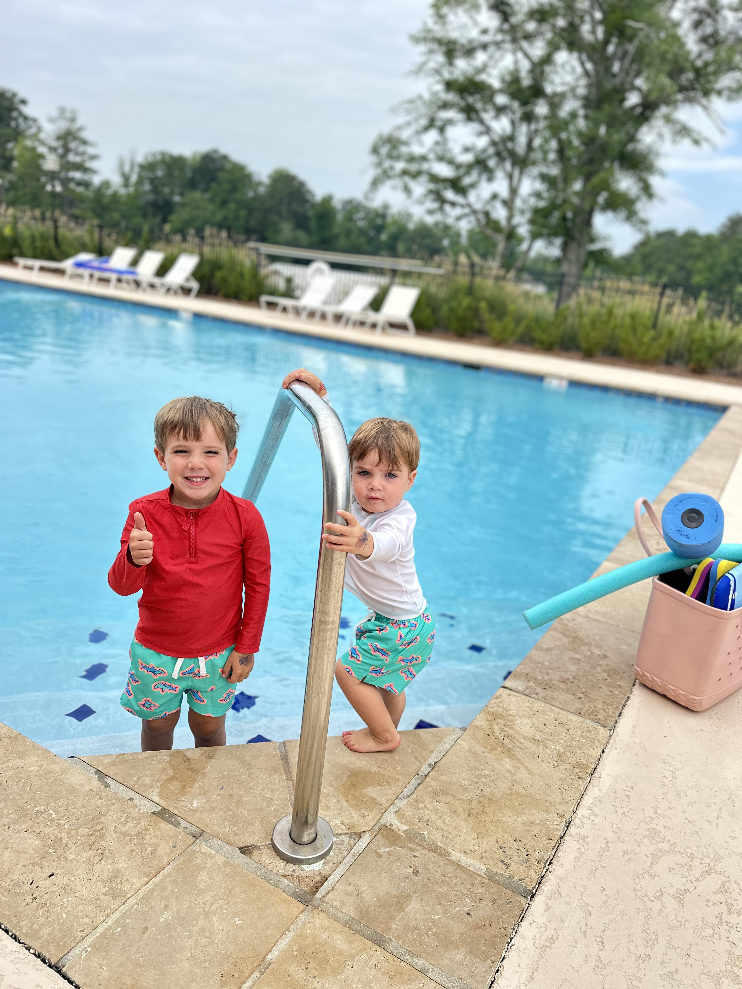 Two children by the pool