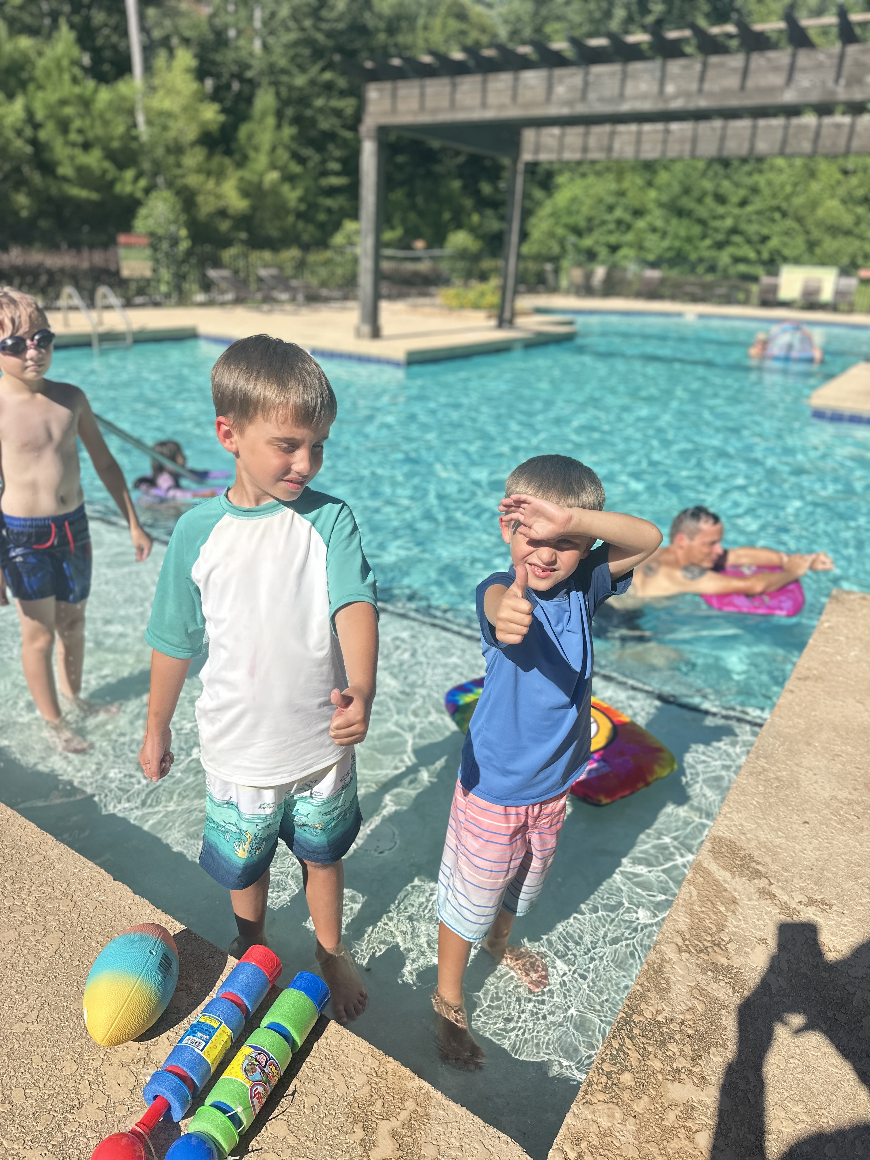 Two boys enjoying swim lessons