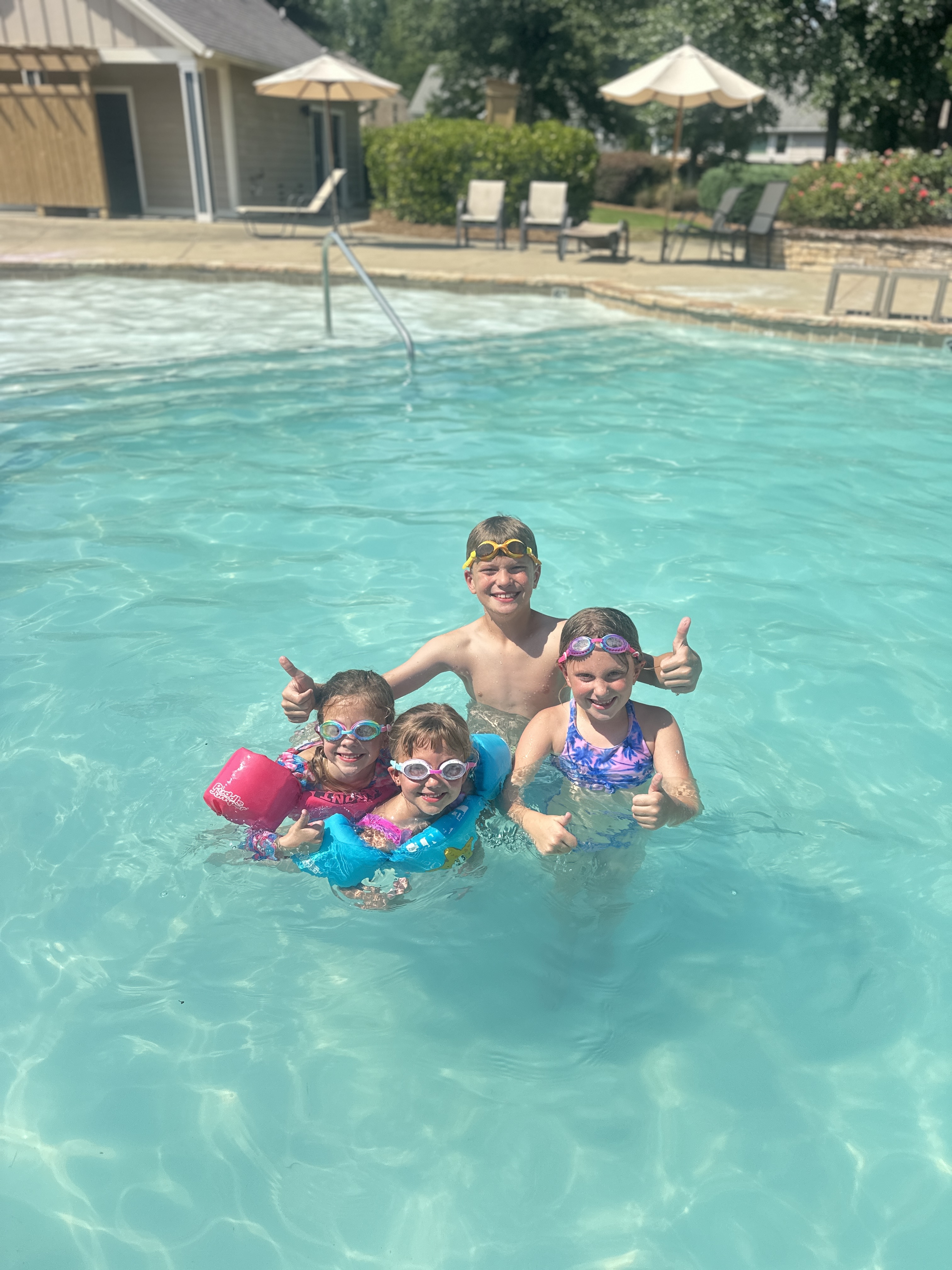 Four happy swimmers together