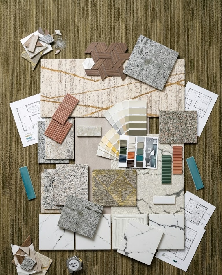 Interior designer reviewing flooring samples with client