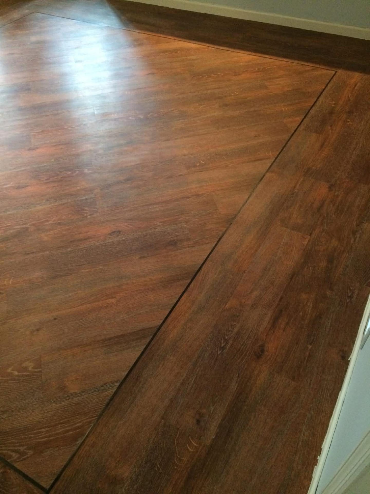 Rustic reclaimed-look hardwood-style luxury vinyl plank flooring
