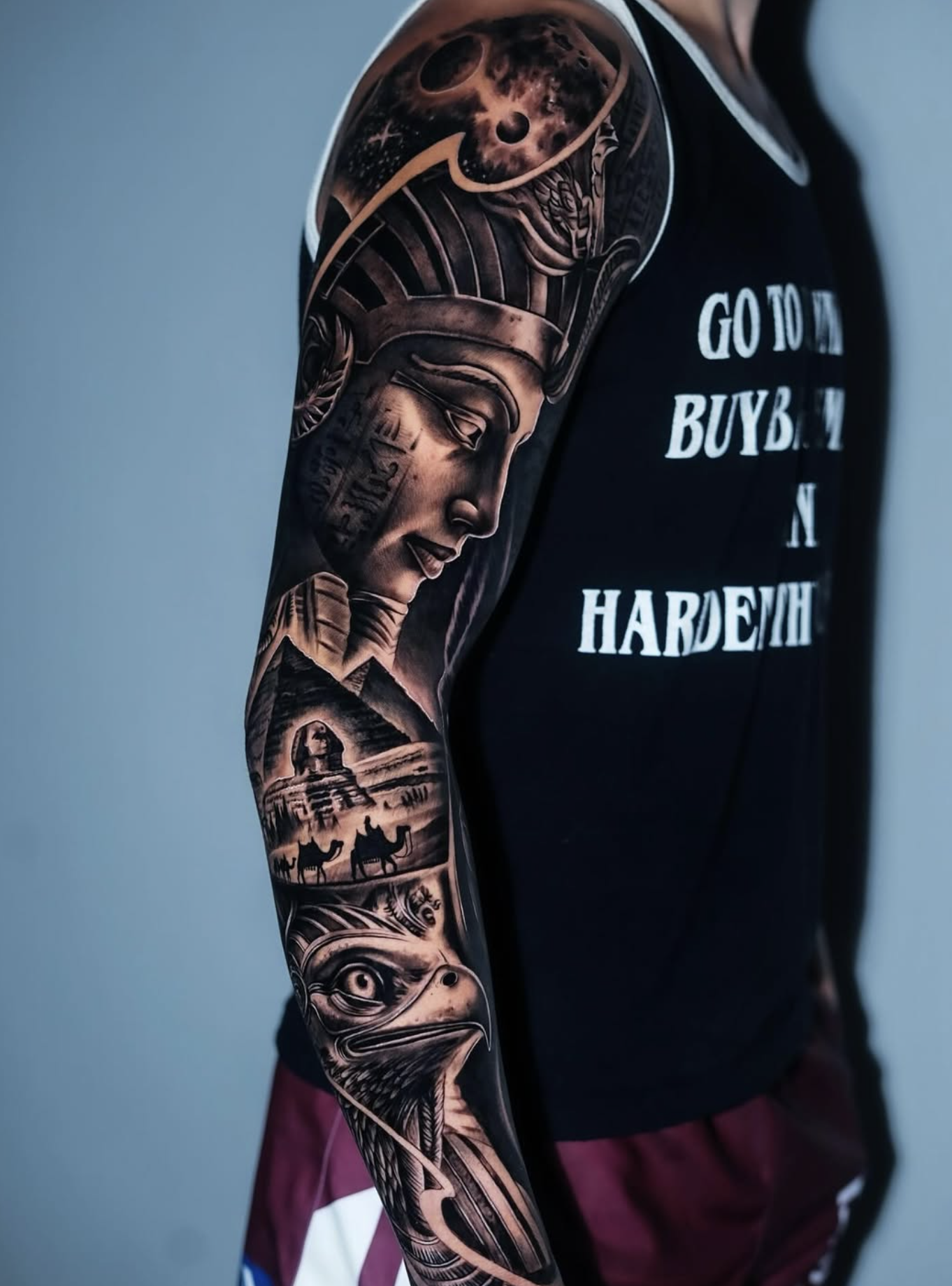 Black and grey realism sleeve tattoo by a Love Gun artist