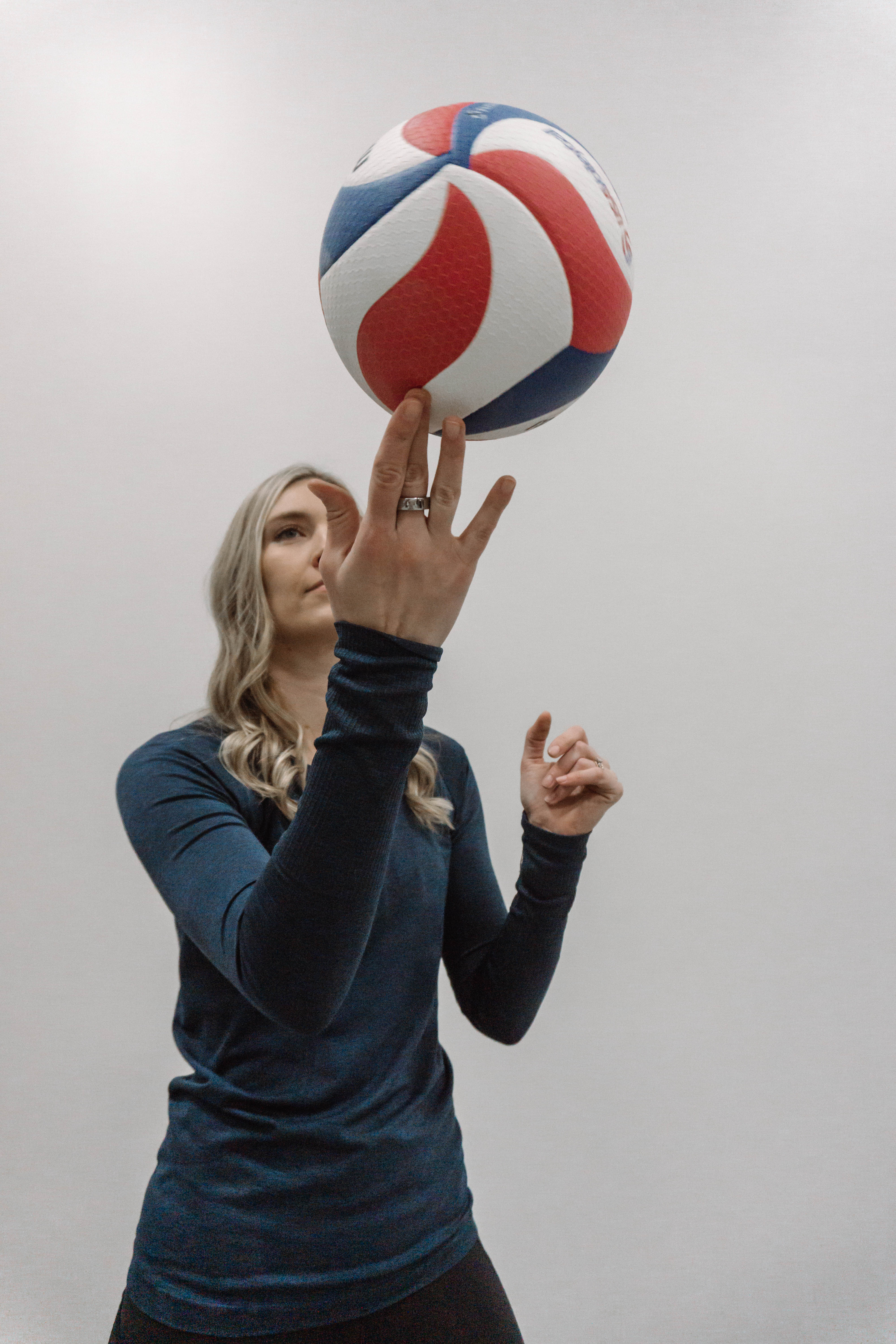 Kristin Bignell, Registered Physical Therapist holding a volleyball
