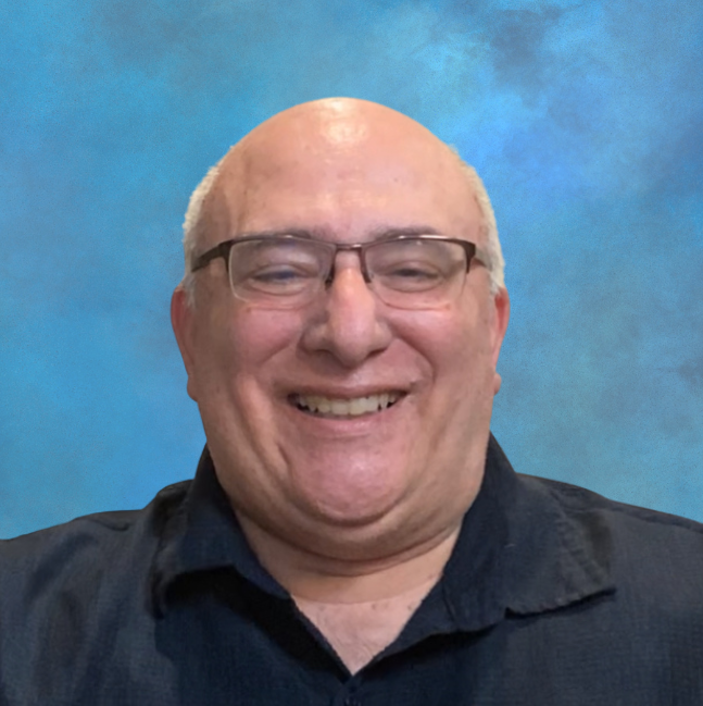 Doug Kalunian, retired psychiatrist and founder of Mastering Your Wellbeing Inc, smiling in a professional headshot.