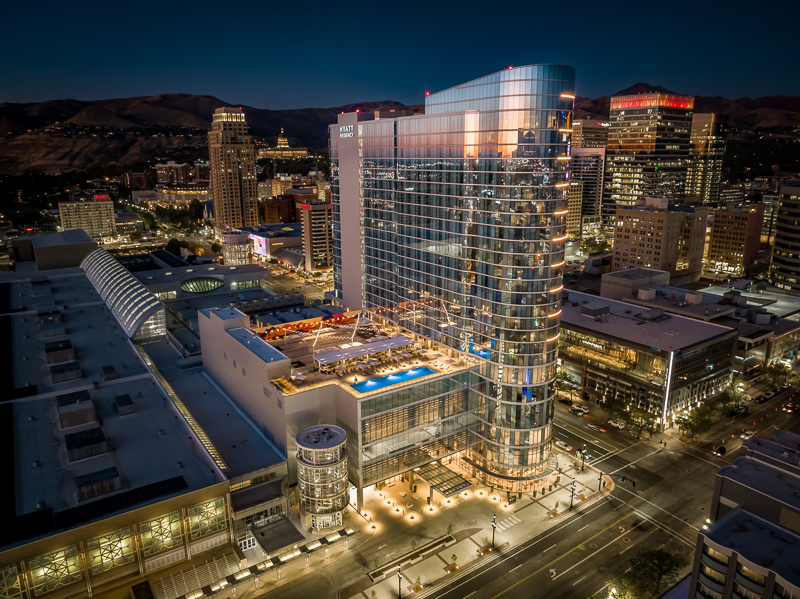 Hyatt Regency Salt Lake City in downtown Salt Lake City at night, host venue for PracticeCon 2026