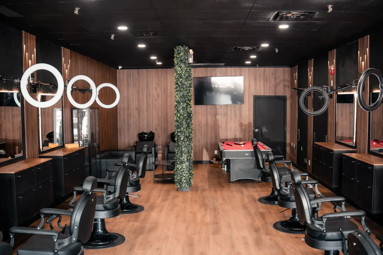 The main floor of the shop, with barber chairs along both walls