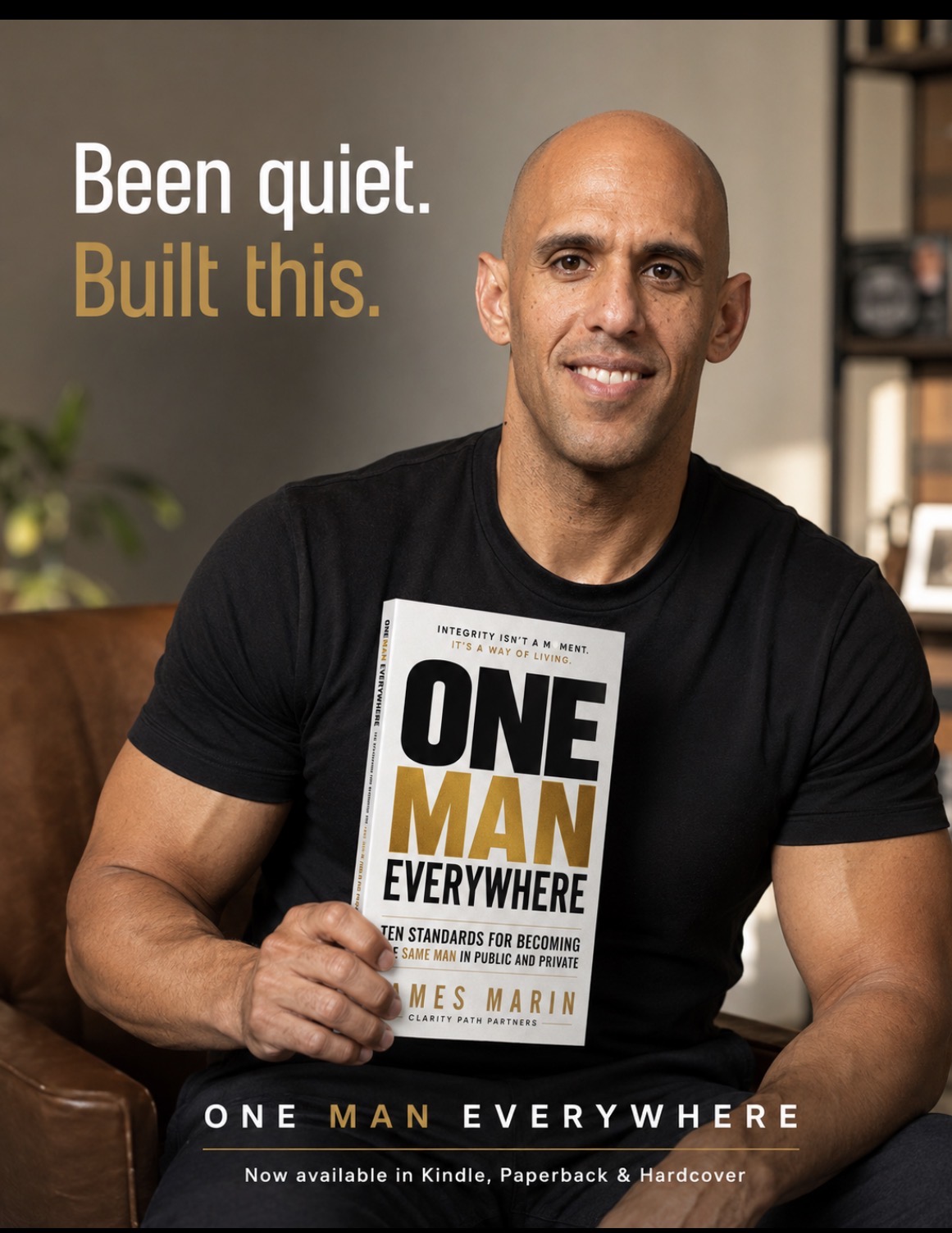 James Marin holding One Man Everywhere