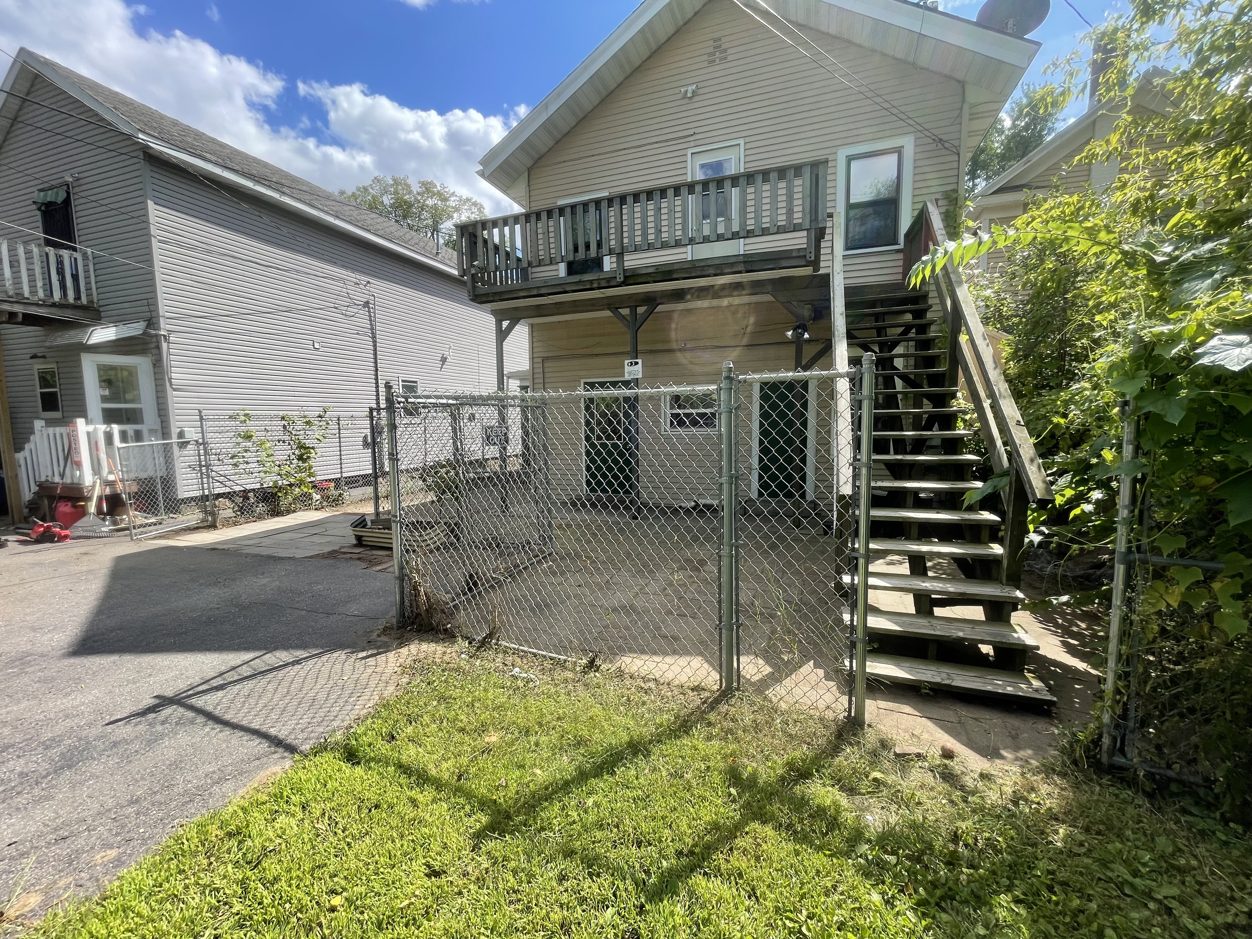 After yard cleanup showing cleared brush, trimmed landscaping, and clean outdoor space by Fishers Lawn Care & Snow Removal