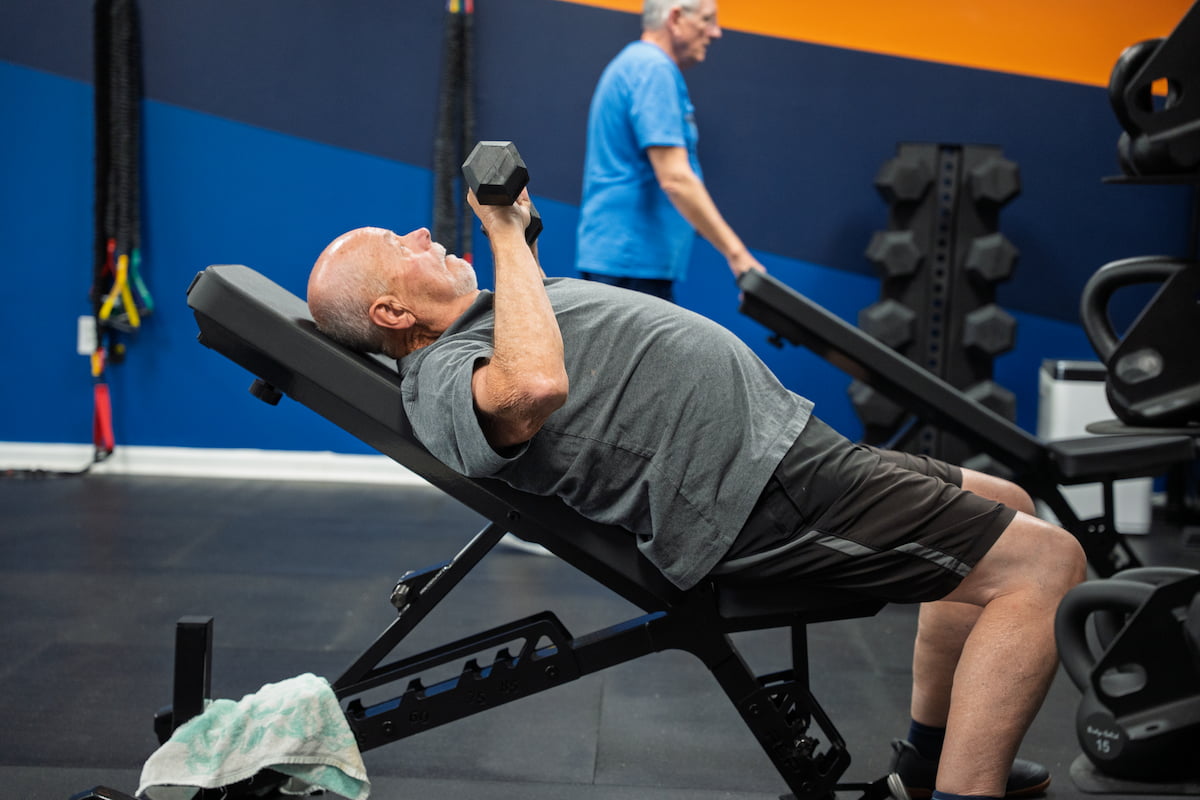 Fitspire members doing dumbbell press during a personal training session