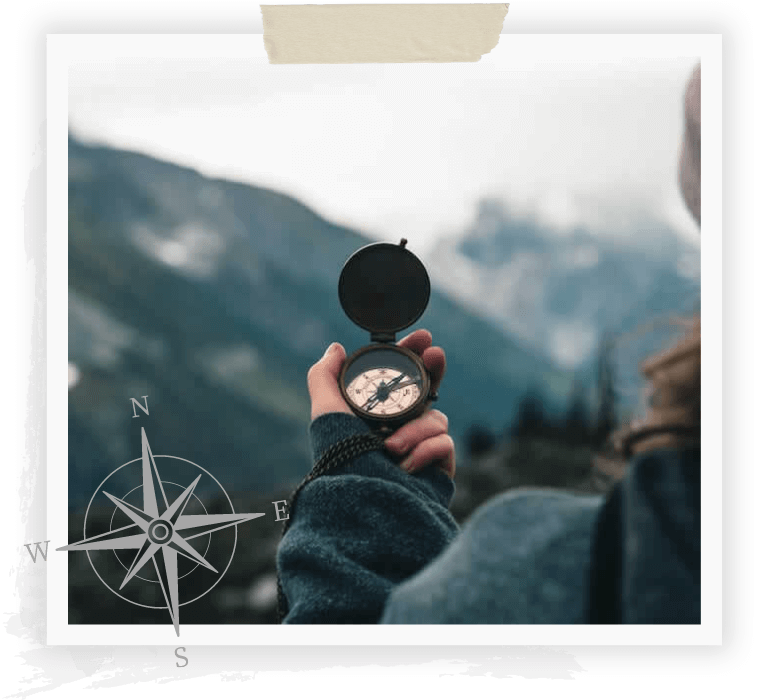 photo of the back of a woman holding a compass