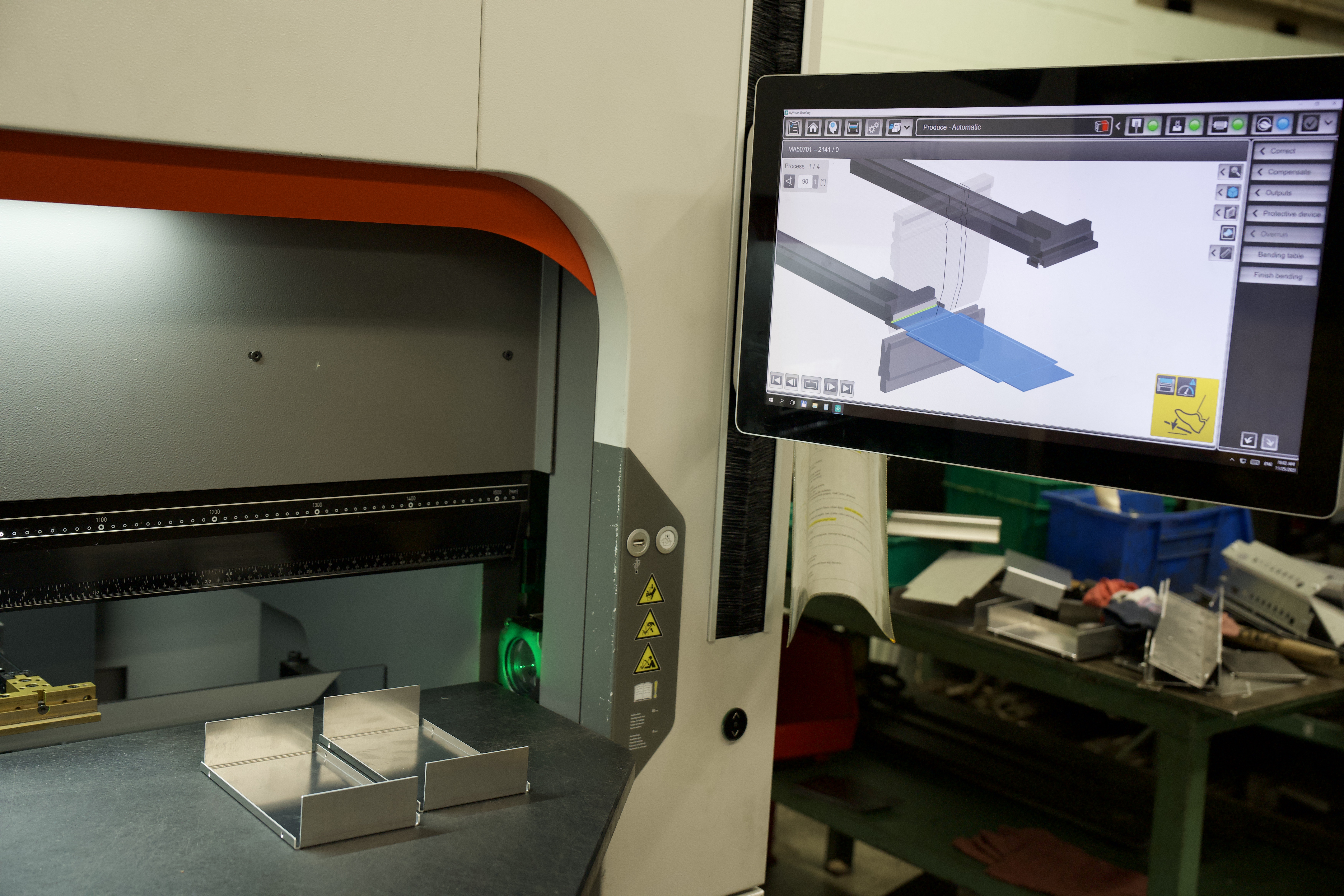 CAD/CAM workstation showing a 3D part model at Manor Tool