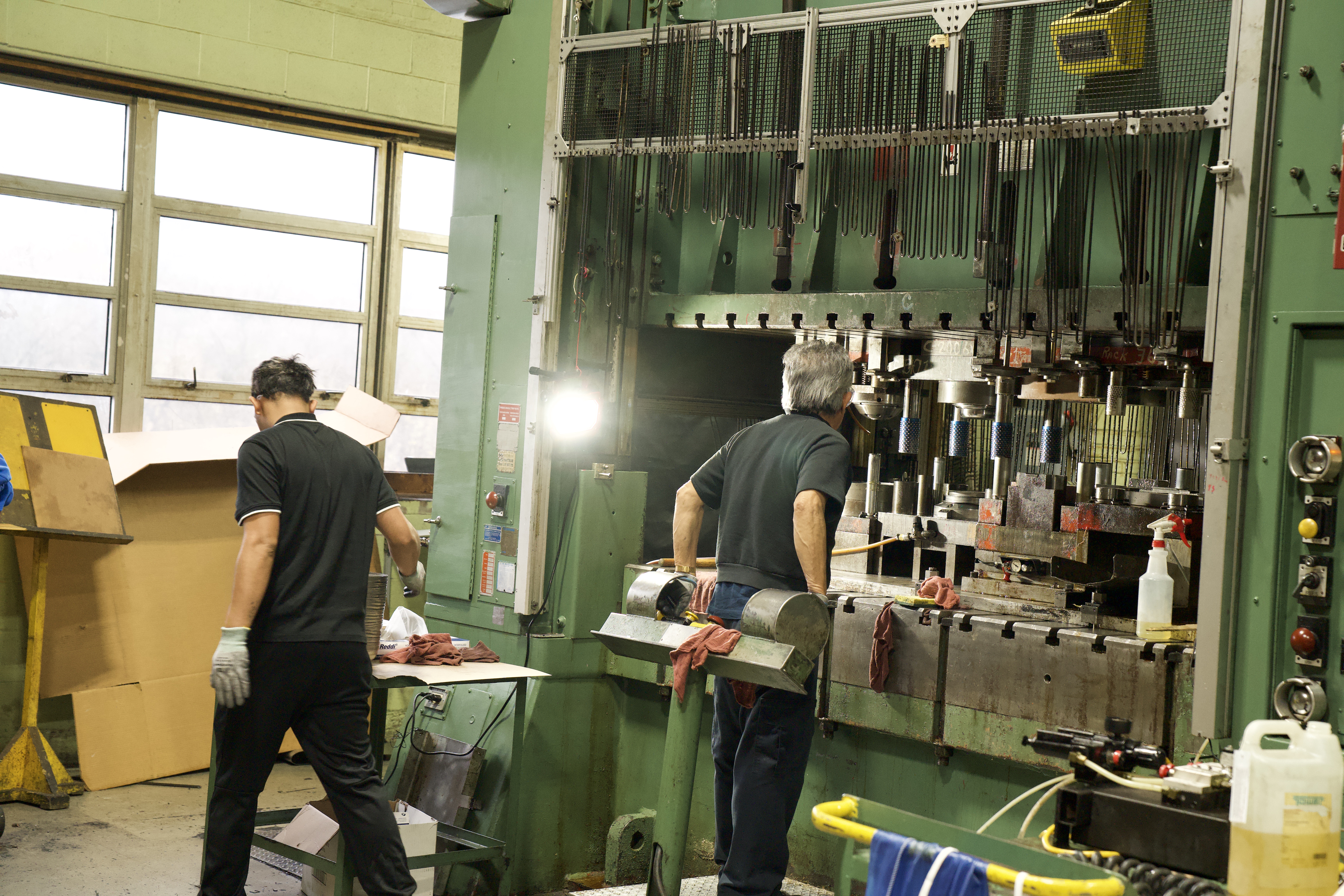 Manor Tool operators running metal stamping presses