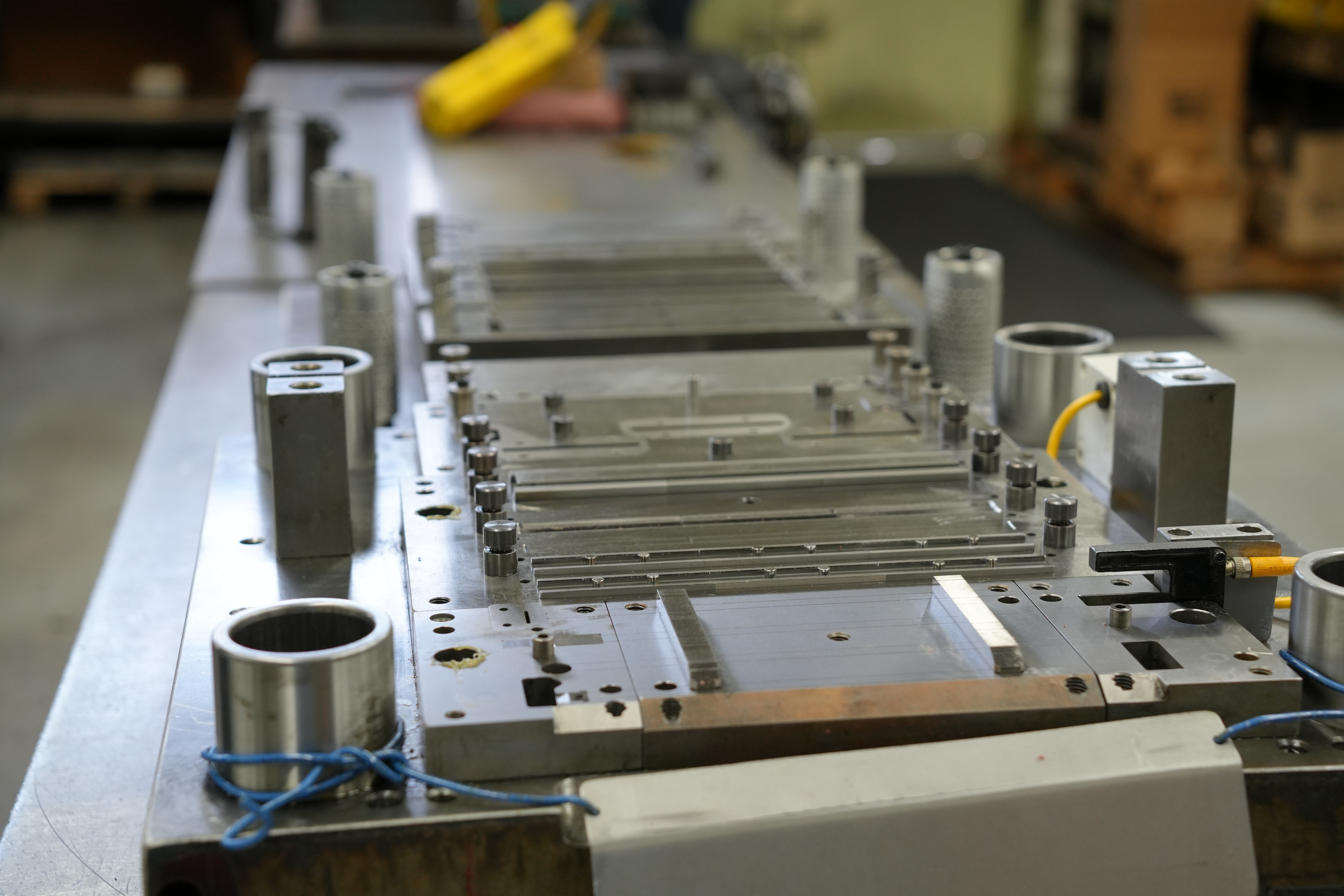 Progressive die with multiple stations at Manor Tool — Schiller Park, IL