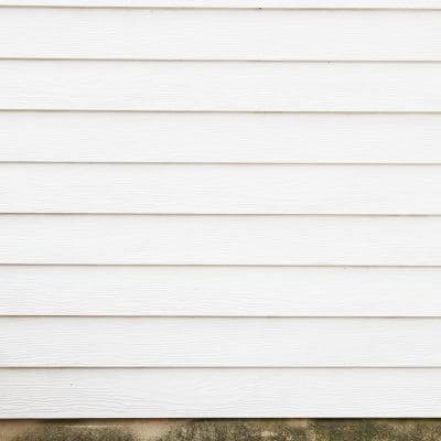 Close-up of freshly installed white vinyl siding