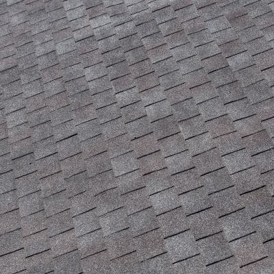 Close-up view of newly installed gray asphalt roof shingles