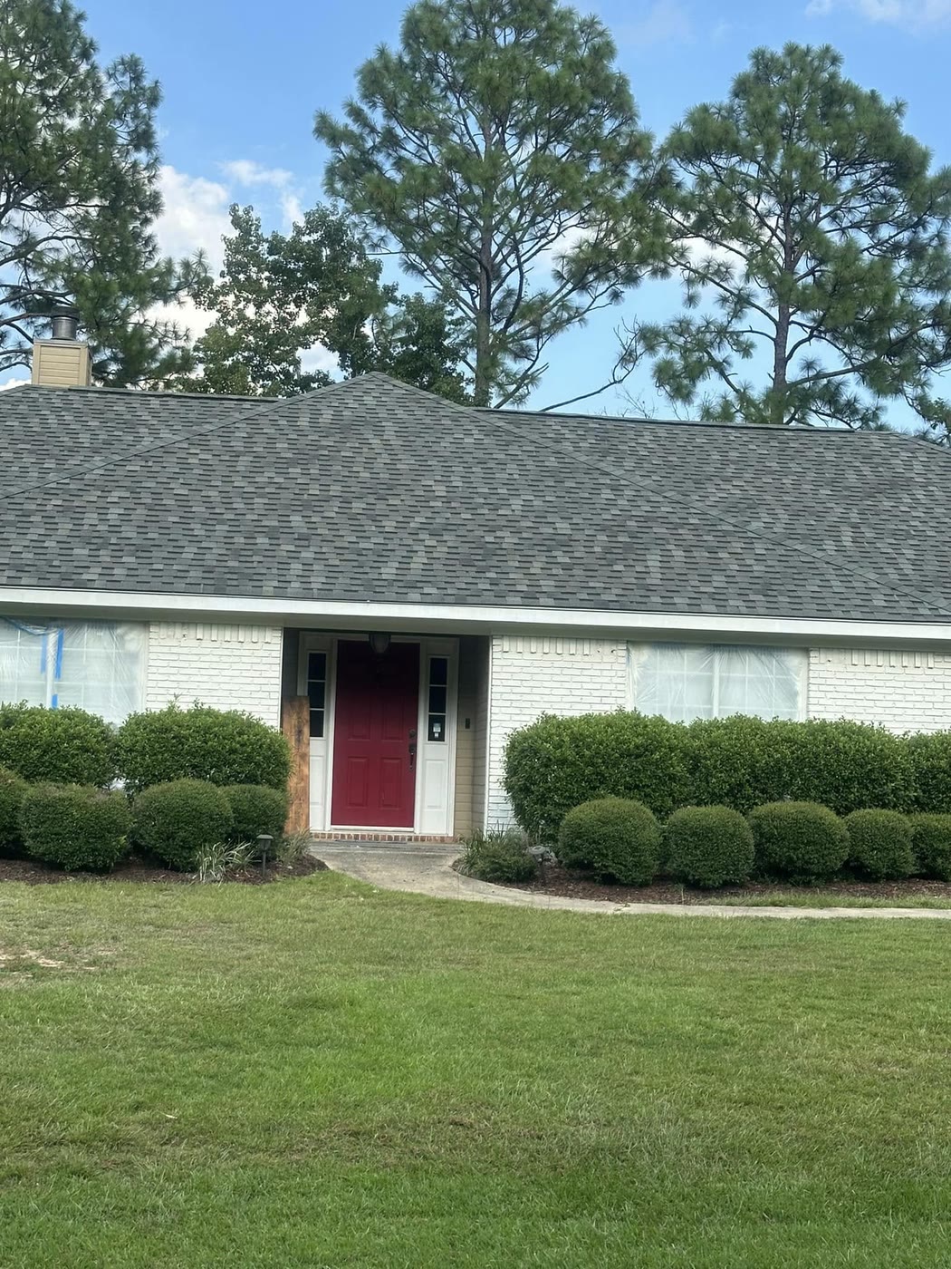 Completed roof replacement on a brick home