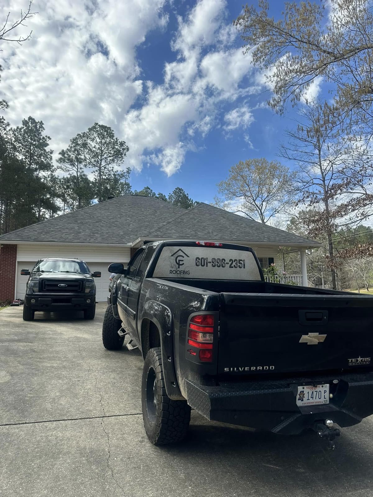 C.F. Life Roofing truck at a completed job in Mississippi