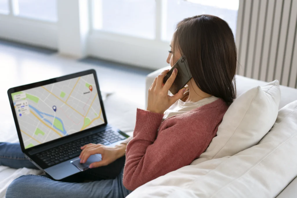 Woman holding laptop reviewing local SEO and digital marketing results - TSG Group New York