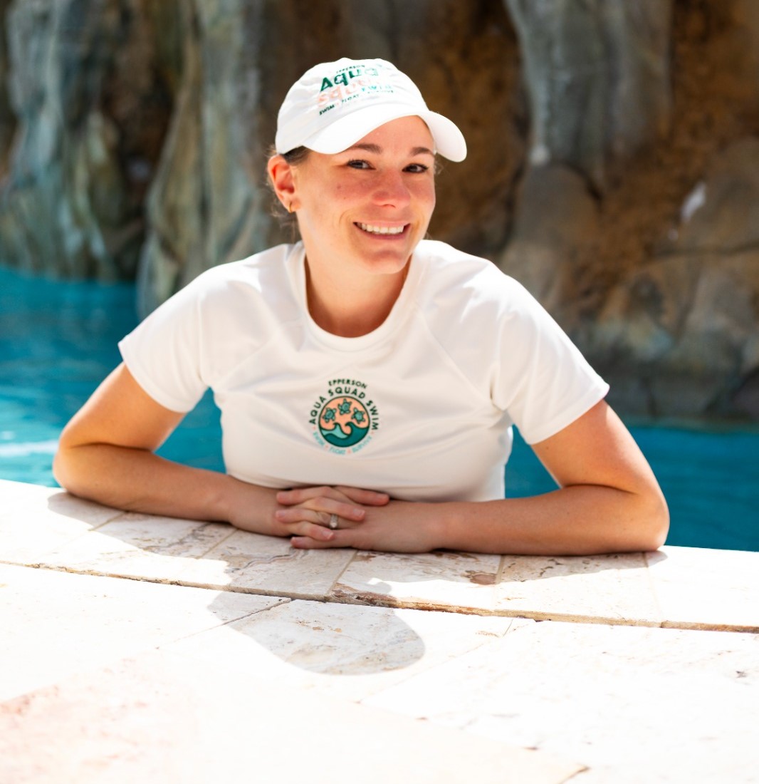 Becca, AquaSquad Swim instructor, in pool during a lesson