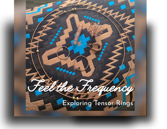 A picture of several tensor rings on a native american patterned blanket.