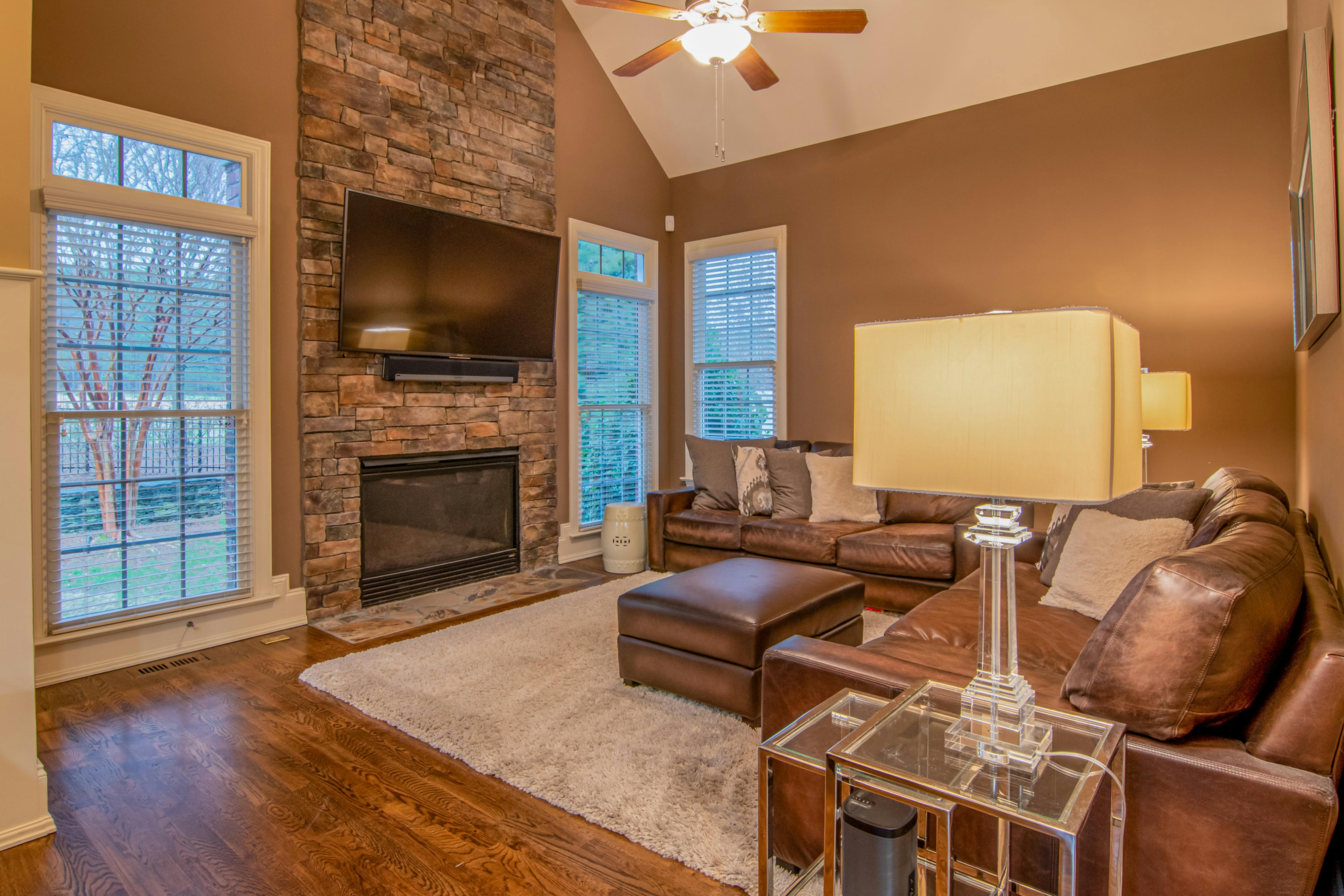 Floor-to-ceiling stone fireplace feature wall