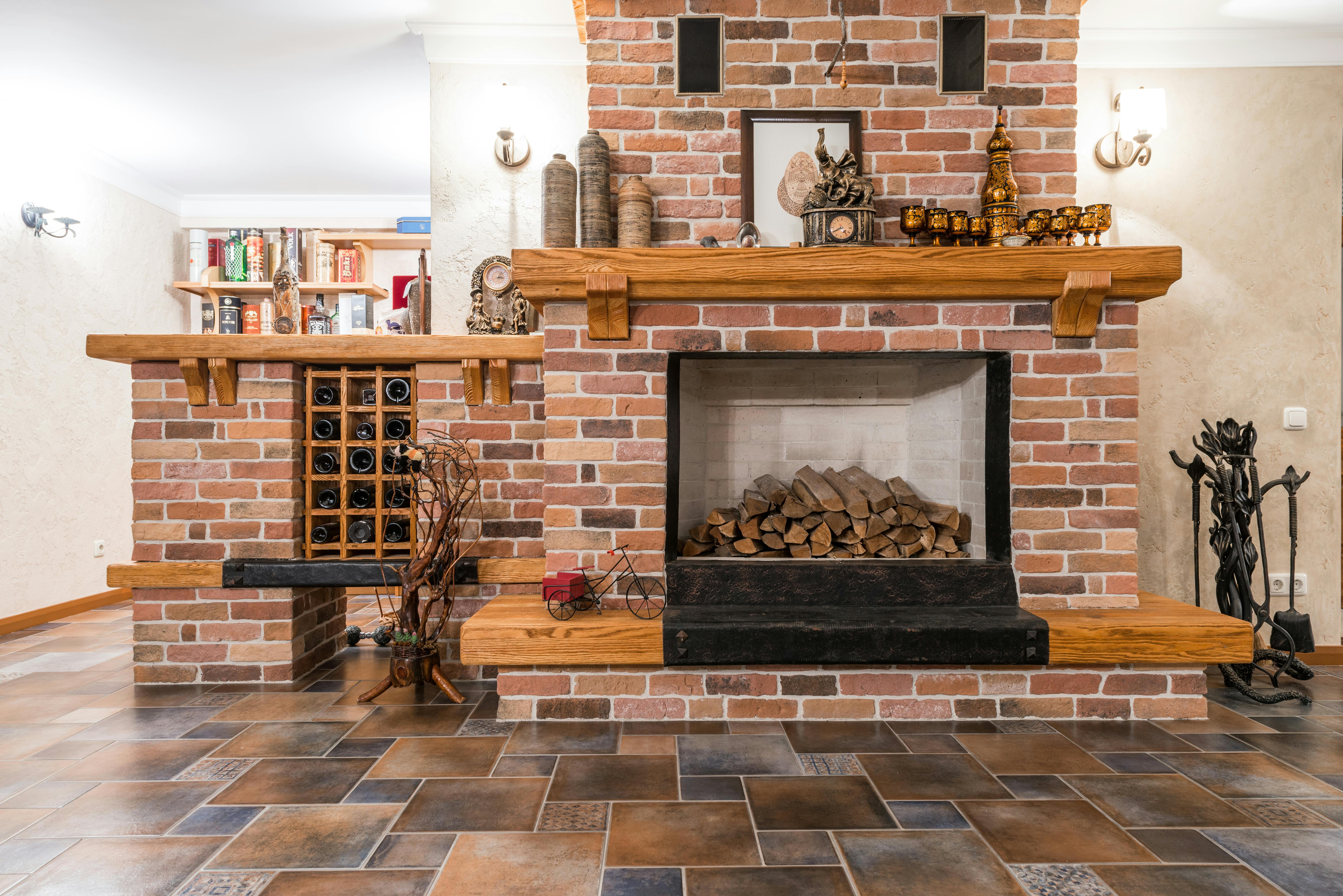 Traditional brick fireplace with wood mantel