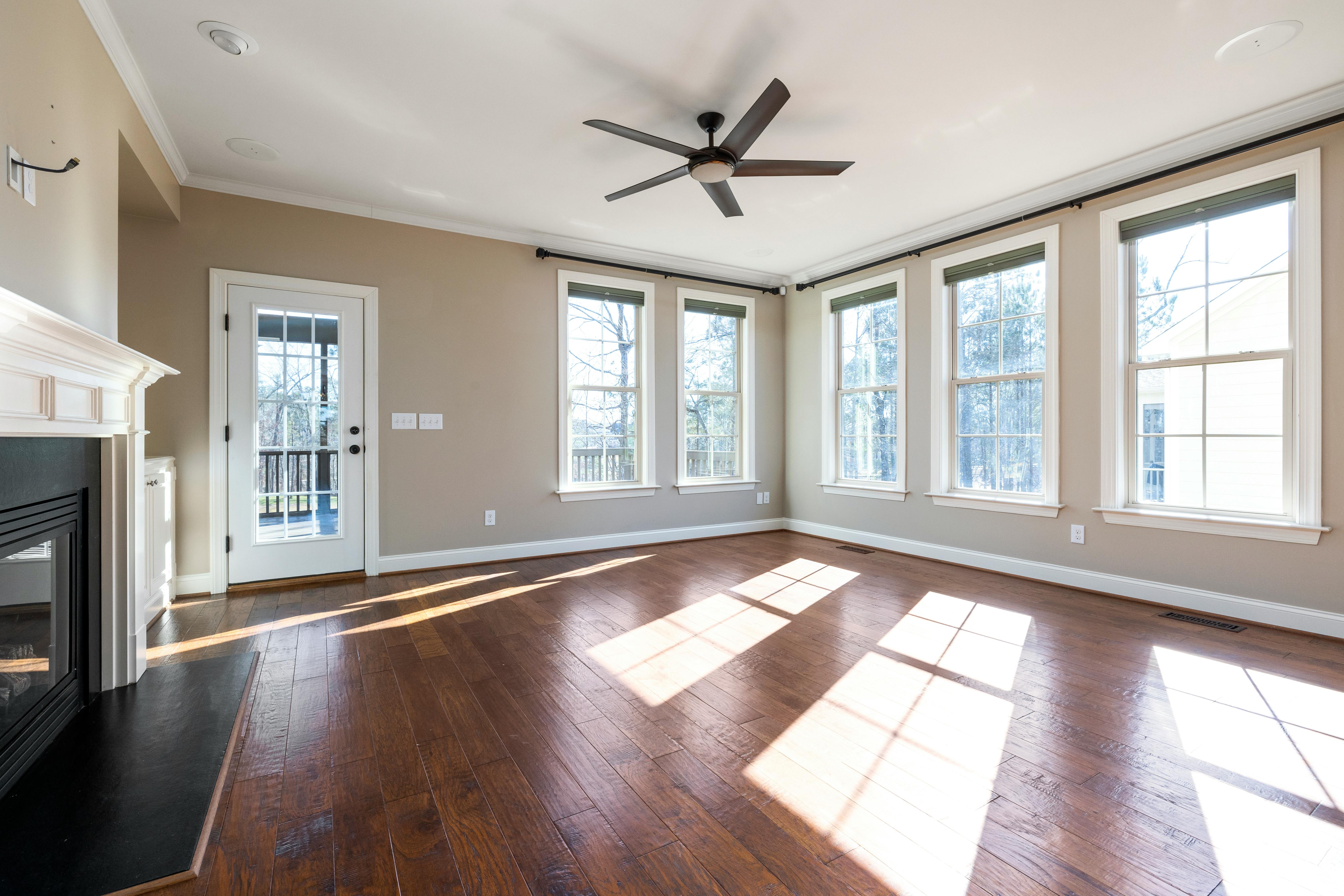 Solid hardwood floor installation and refinishing in a Cleveland-area home interior