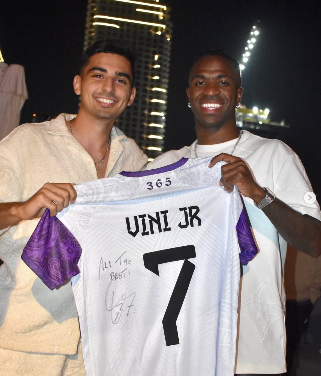 Soheil Var and Ric with Vini Jr signed jersey