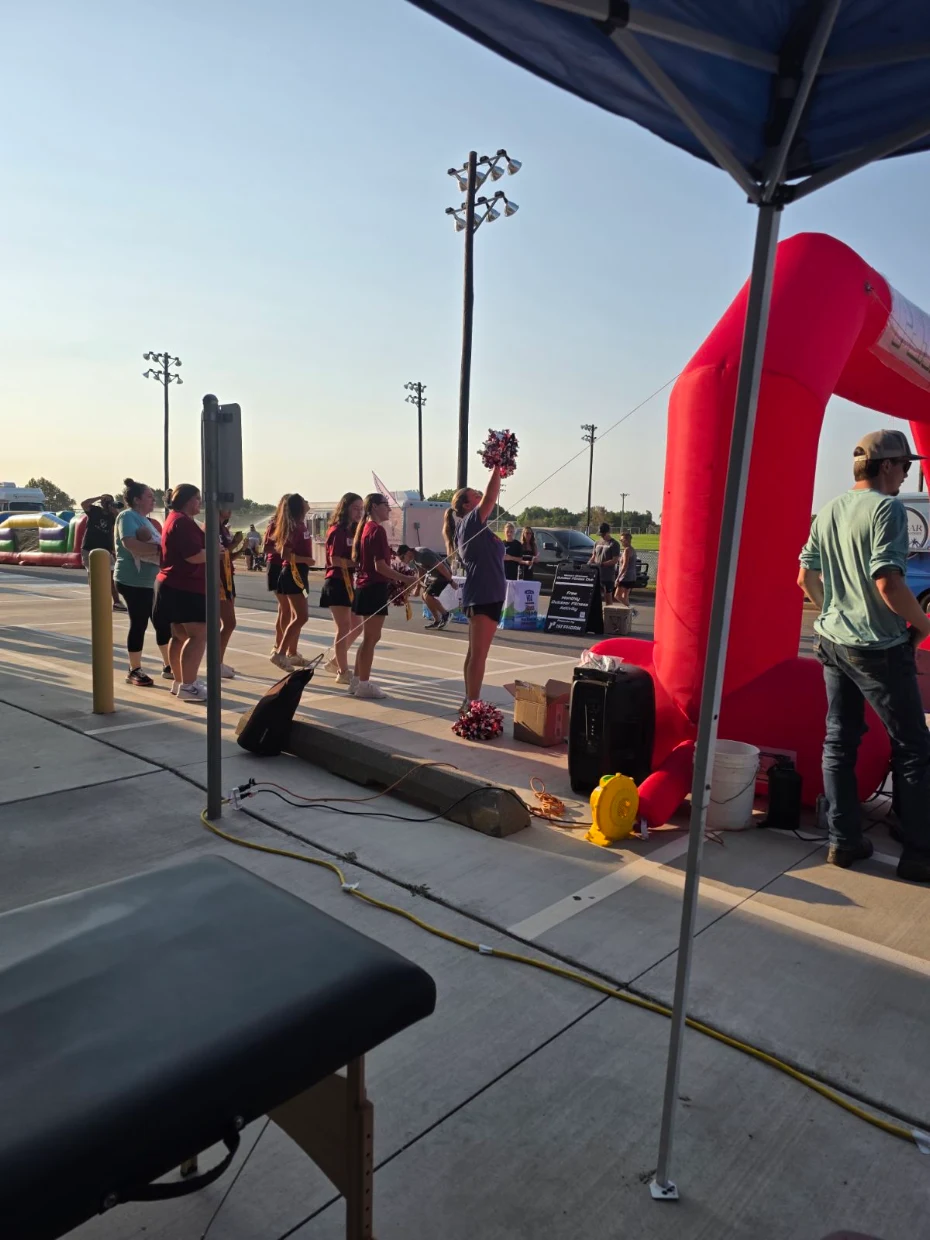 a TheraWest therapist helping people get excited at an event a TheraWest therapist helping people get excited at an event