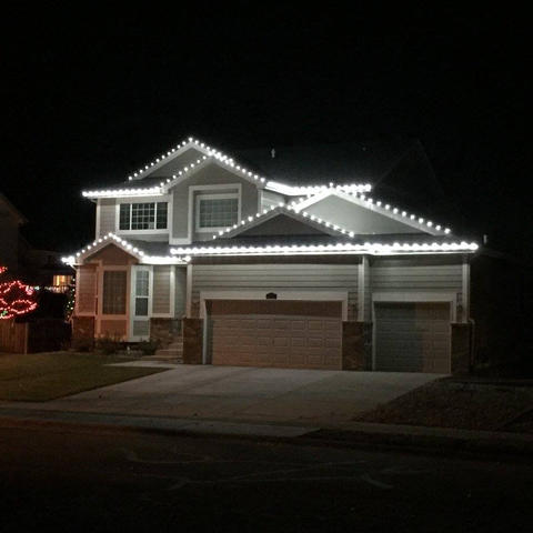 Fort Collins home with pure cool white C9 LED Christmas lights installed along the roofline