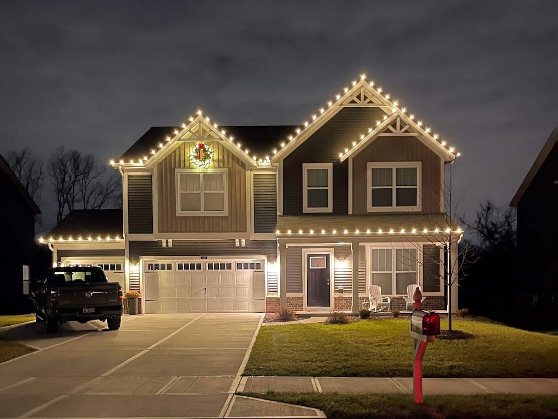 Warm white C9 Christmas lights professionally installed on a Fort Collins residence