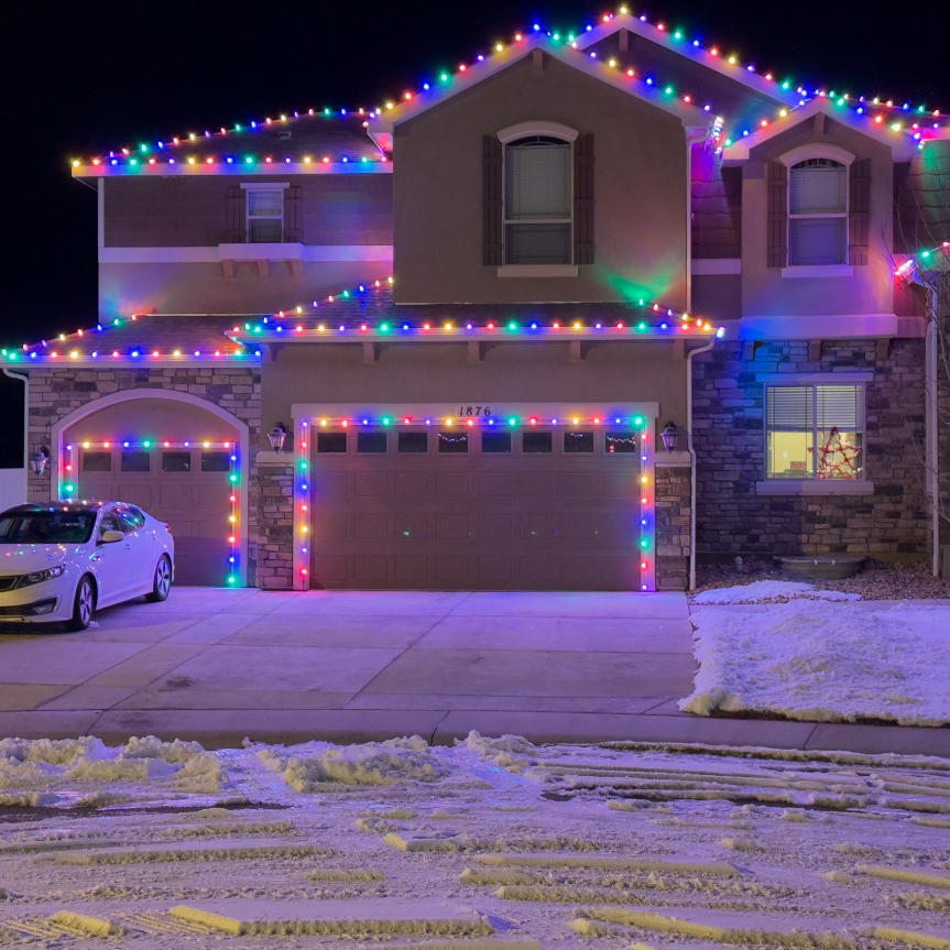 Professional multi-color C9 Christmas light installation on a Fort Collins residence