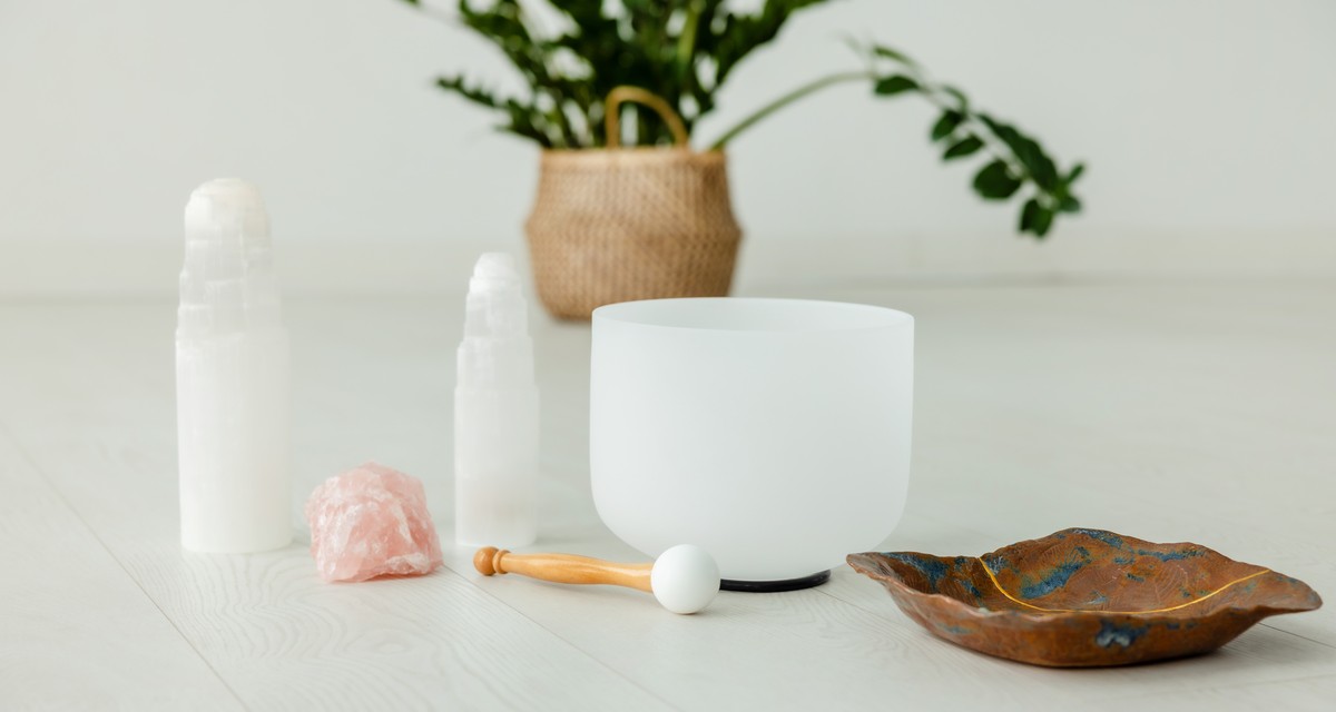 Sound meditation, crystal singing bowls in candlelight